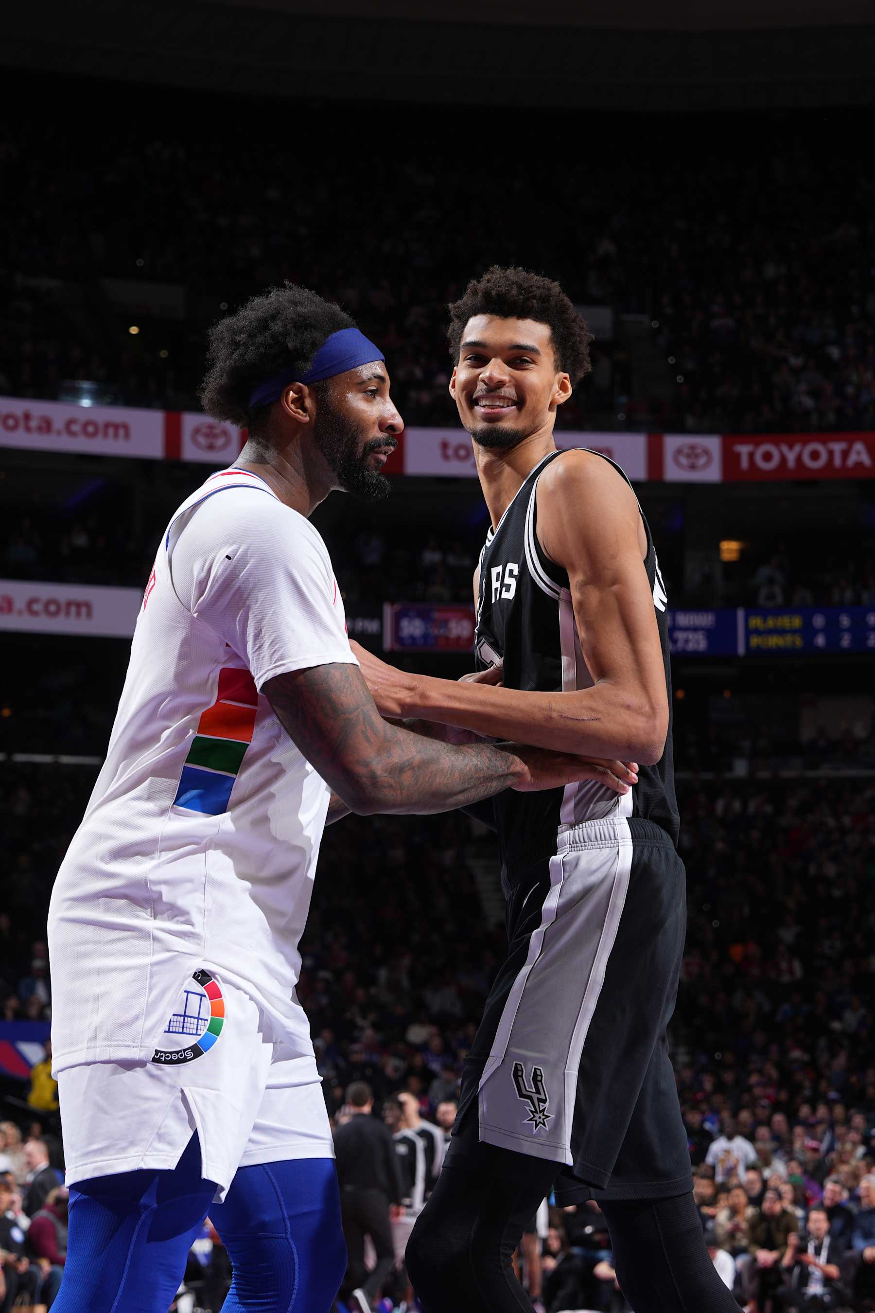 PHILADELPHIA, PA - DECEMBER 23: Andre Drummond #5 of the Philadelphia 76ers and Victor Wembanyama #1 of the San Antonio Spurs look on during the game on December 23, 2024 at the Wells Fargo Center in Philadelphia, Pennsylvania NOTE TO USER: User expressly acknowledges and agrees that, by downloading and/or using this Photograph, user is consenting to the terms and conditions of the Getty Images License Agreement. Mandatory Copyright Notice: Copyright 2024 NBAE (Photo by Jesse D. Garrabrant/NBAE via Getty Images)