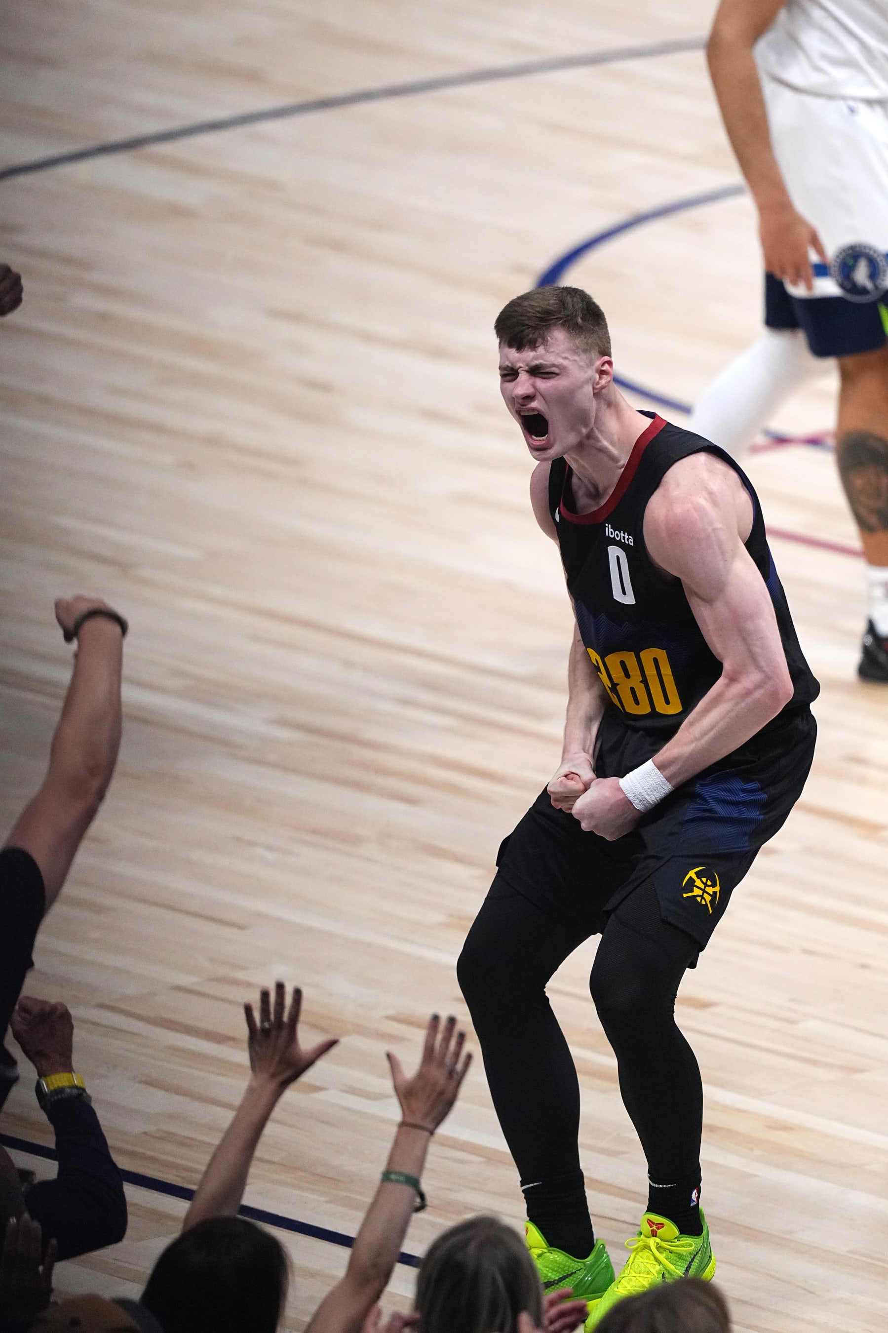 DENVER, CO - MAY 14: Christian Braun #0 of the Denver Nuggets reacts against the Minnesota Timberwolves during Round 2 Game 5 of the 2024 NBA Playoffs on May 14, 2024 at the Ball Arena in Denver, Colorado. NOTE TO USER: User expressly acknowledges and agrees that, by downloading and/or using this Photograph, user is consenting to the terms and conditions of the Getty Images License Agreement. Mandatory Copyright Notice: Copyright 2024 NBAE (Photo by Bart Young/NBAE via Getty Images)