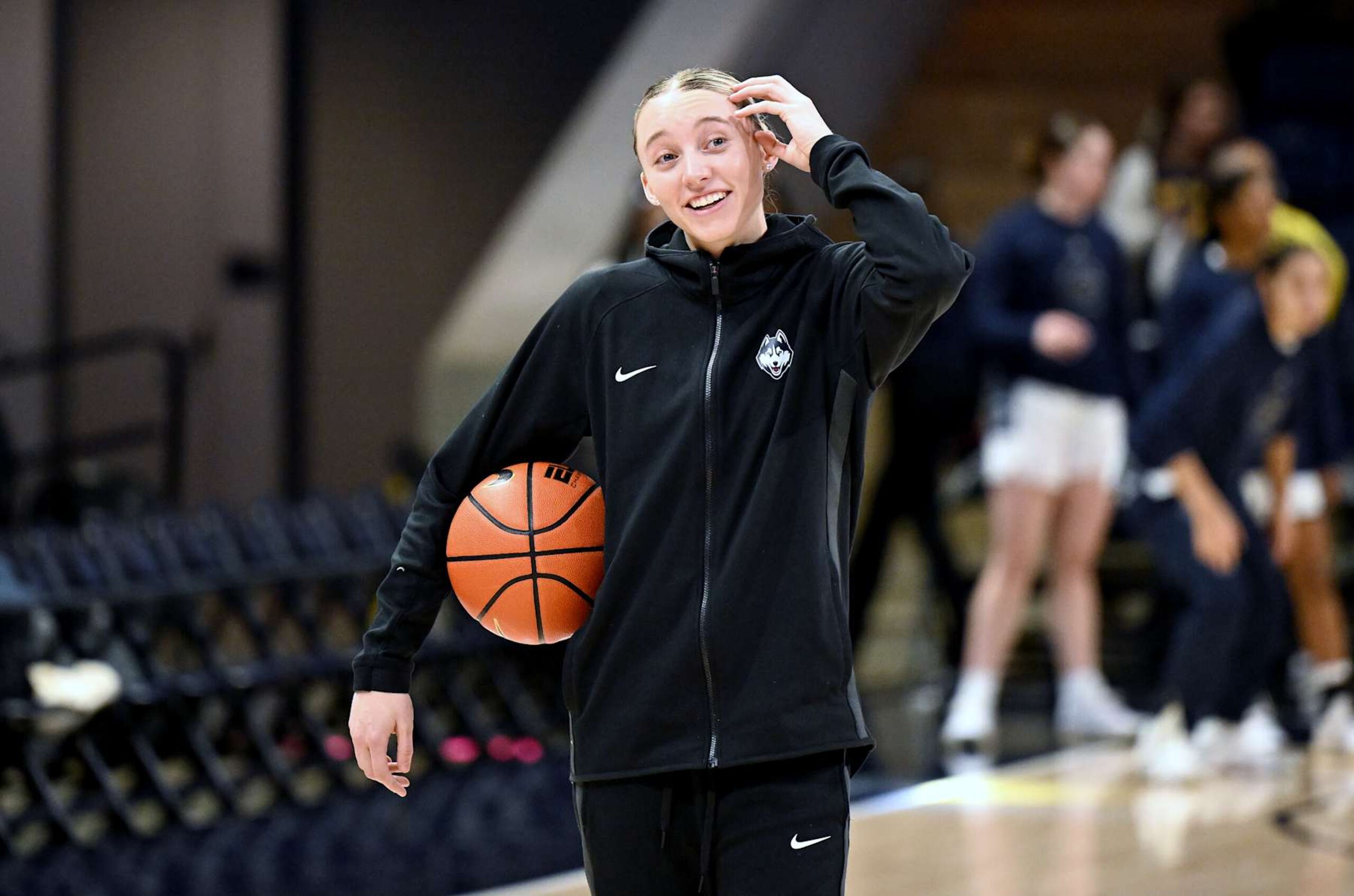 WASHINGTON, DC - JANUARY 11: Paige Bueckers #5 of the UConn Huskies helps her team warm up before the game against the Georgetown Hoyas at Entertainment & Sports Arena on January 11, 2025 in Washington, DC. (Photo by G Fiume/Getty Images)