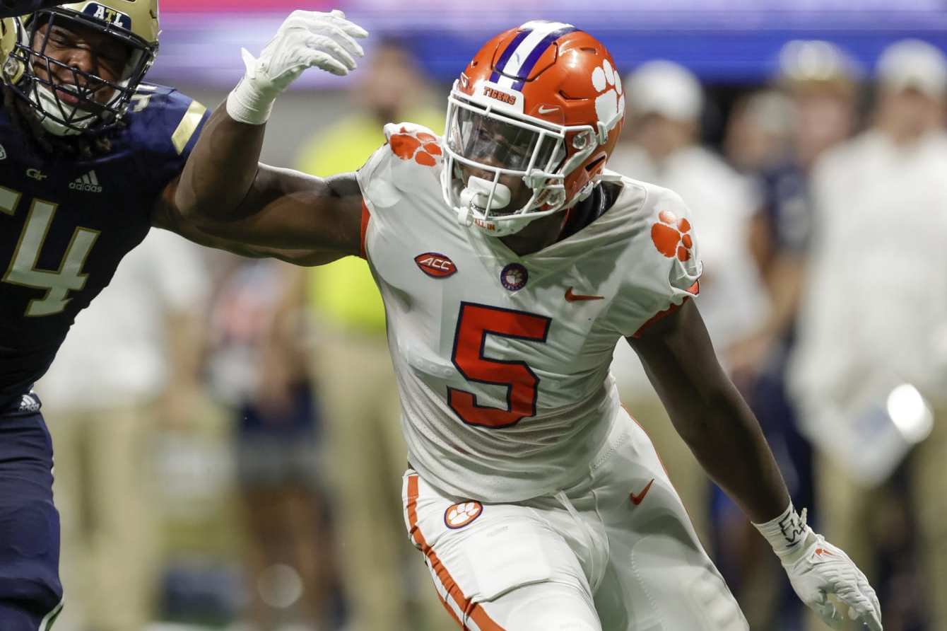 Georgia Tech's Jordan Williams (54) blocks Clemson's K.J. Henry (5) during the first half of an NCAA football game on Monday, Sept. 5, 2022, in Atlanta. (AP Photo/Stew Milne)