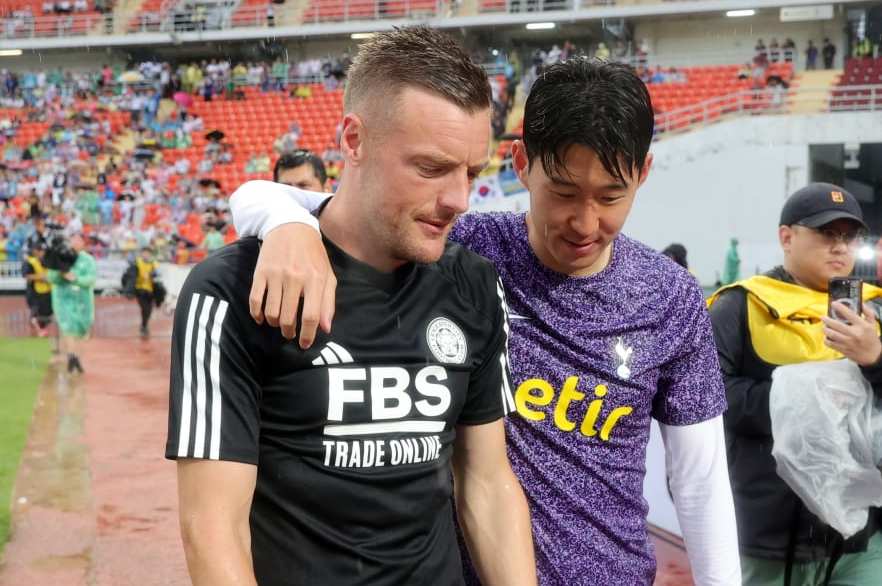 BANGKOK, THAILAND - JULY 23: Jamie Vardy of Leicester City and Son Heung-Min of Tottenham Hotspur during a lap of the pitch to thank fans and mascots for their support after the pre-season friendly match between Tottenham Hotspur and Leicester City at Rajamangala Stadium was cancelled on July 23, 2023 in Bangkok, Thailand. The match was cancelled due to weather conditions. (Photo by Plumb Images/Leicester City FC via Getty Images)