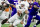 NEW ORLEANS, LA - JANUARY 01: Washington quarterback Michael Penix Jr. (9) attempts to avoid the tackle of Texas defensive lineman Byron Murphy II (90) during the Allstate Sugar Bowl playoff game between the Texas Longhorns and the Washington Huskies on Monday, January 1, 2024 at Caesars Superdome in New Orleans, LA. (Photo by Nick Tre. Smith/Icon Sportswire via Getty Images)