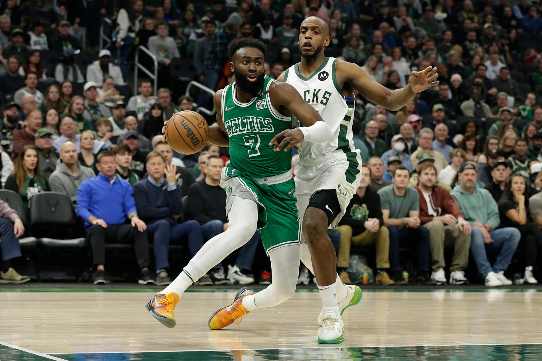 MILWAUKEE, WISCONSIN - APRIL 07: Jaylen Brown #7 of the Boston Celtics drives to the basket on Khris Middleton #22 of the Milwaukee Bucks during the first half of a game at Fiserv Forum on April 07, 2022 in Milwaukee, Wisconsin. NOTE TO USER: User expressly acknowledges and agrees that, by downloading and or using this photograph, User is consenting to the terms and conditions of the Getty Images License Agreement. (Photo by John Fisher/Getty Images)