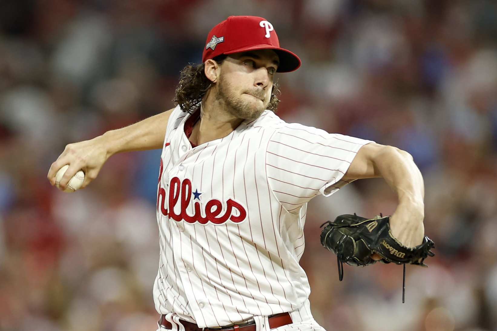 PHILADELPHIA, PENNSYLVANIA - OCTOBER 17: Aaron Nola #27 of the Philadelphia Phillies throws a first inning pitch against the Arizona Diamondbacks during Game Two of the Championship Series at Citizens Bank Park on October 17, 2023 in Philadelphia, Pennsylvania. (Photo by Sarah Stier/Getty Images)
