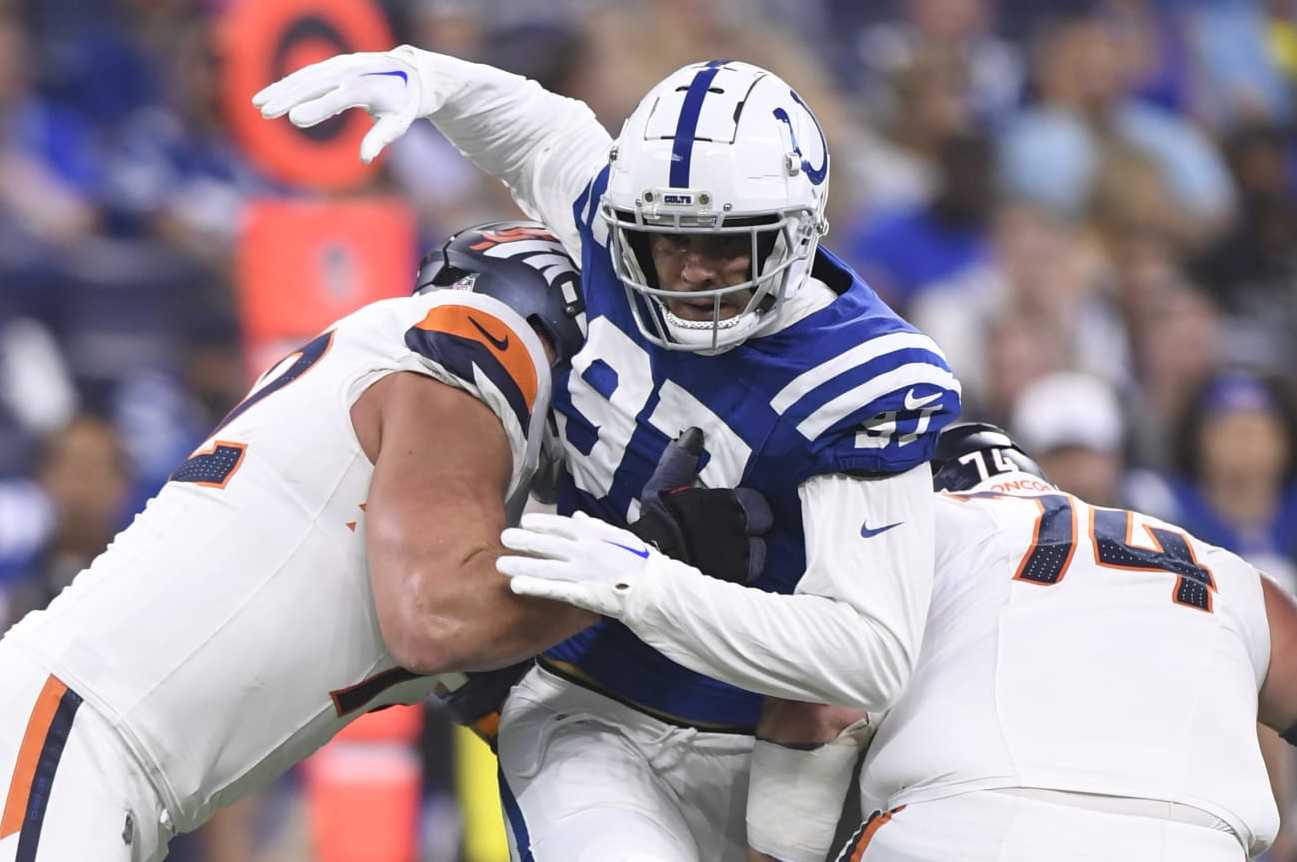 INDIANAPOLIS, IN - AUGUST 11: Denver Broncos Tackle Garett Bolles (72) and Denver Broncos Guard Ben Powers (74) block Indianapolis Colts Defensive End Laiatu Latu (97) during the NFL Preseason game between the Denver Broncos and the Indianapolis Colts on August 11, 2024, at Lucas Oil Stadium in Indianapolis, Indiana. (Photo by Michael Allio/Icon Sportswire via Getty Images)