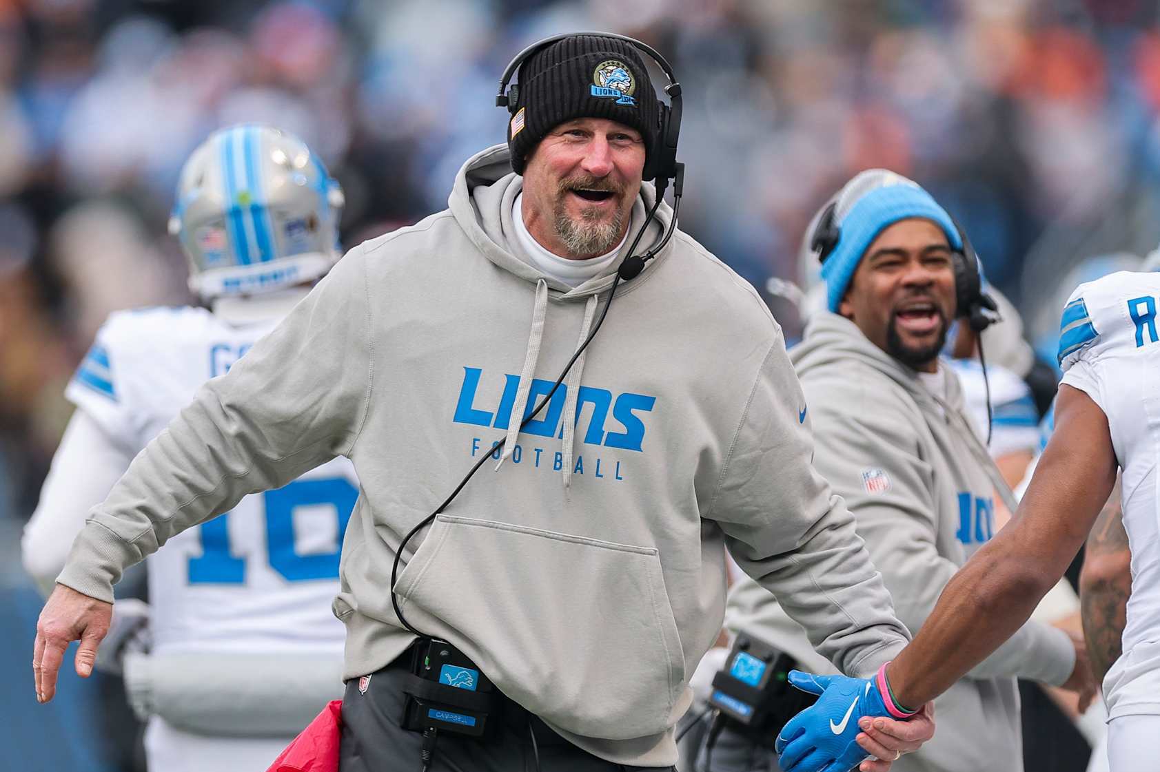 CHICAGO, ILLINOIS - DECEMBER 22: Head coach Dan Campbell of the Detroit Lions celebrates after his team's touchdown against the Chicago Bears during the third quarter at Soldier Field on December 22, 2024 in Chicago, Illinois. (Photo by Michael Reaves/Getty Images)