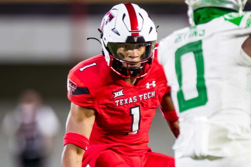 LUBBOCK, TEXAS - SEPTEMBER 09: Dadrion Taylor-Demerson #1 of the Texas Tech Red Raiders defends against Bucky Irving #0 of the Oregon Ducks during the second half of the game at Jones AT&T Stadium on September 09, 2023 in Lubbock, Texas. (Photo by John E. Moore III/Getty Images)