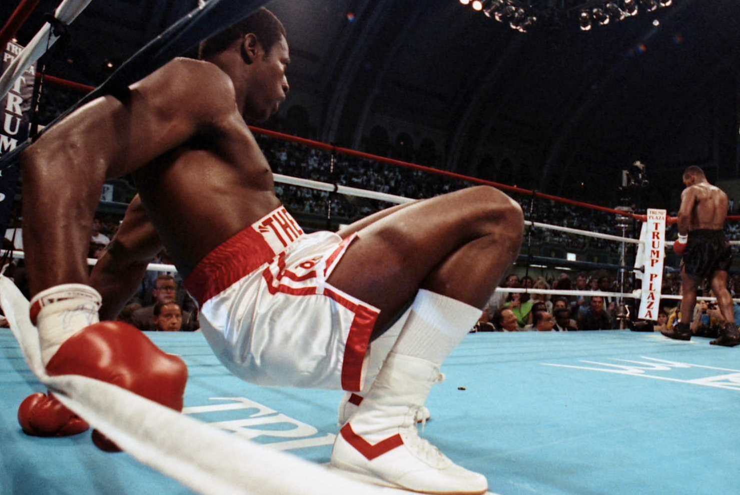 ATLANTIC CITY - JULY 21,1989: Mike Tyson (R) walks to his corner after knocking down Carl Williams during the bout at the Convention Center on July 21, 1989 in Atlantic City, New Jersey. Mike Tyson won the WBC heavyweight title,WBA World heavyweight title and the IBF heavyweight title. (Photo by: The Ring Magazine via Getty Images)