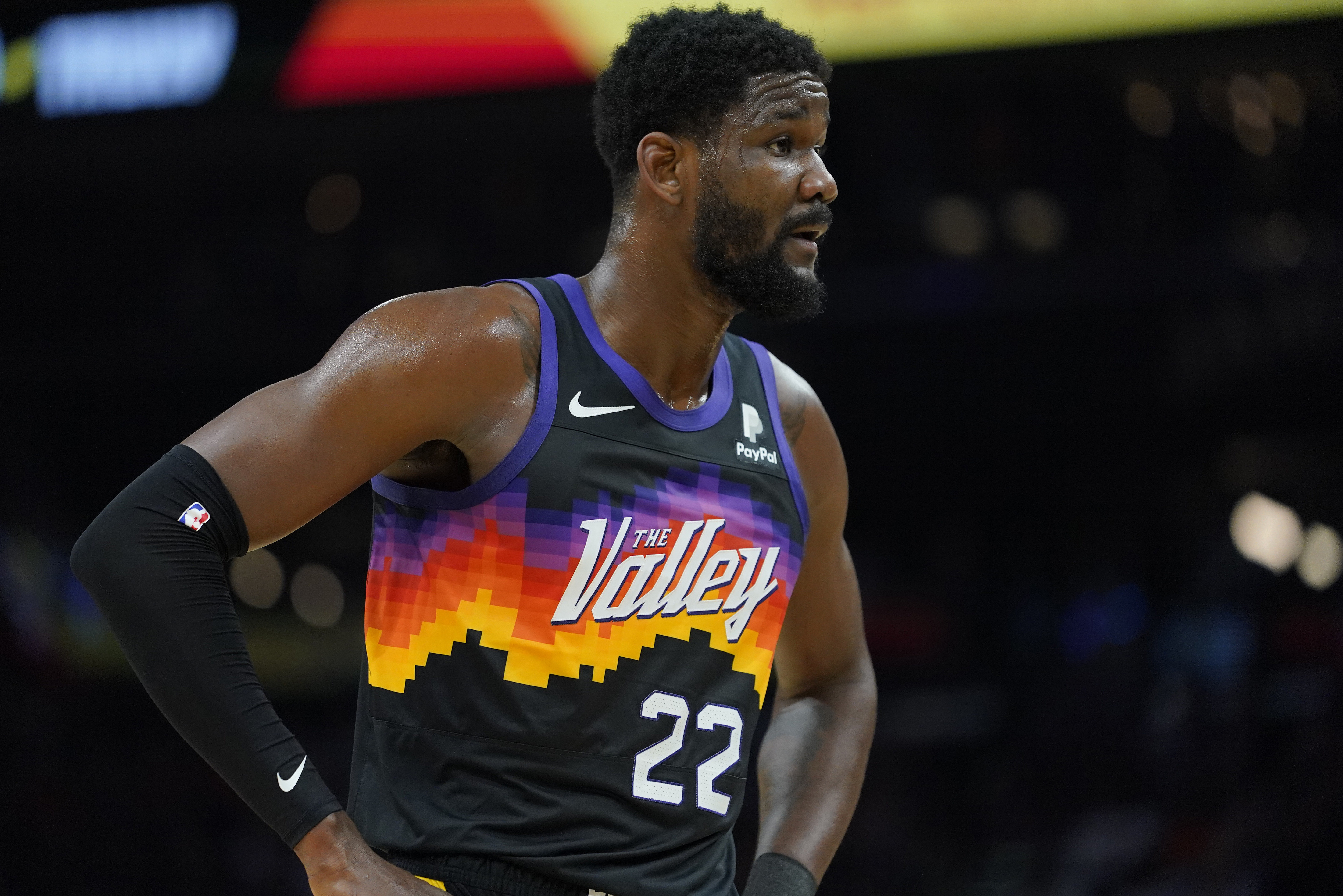 Phoenix Suns center Deandre Ayton (22) looks away after being fouled during the first half of Game 7 of an NBA basketball Western Conference playoff semifinal against theDallas Mavericks, Sunday, May 15, 2022, in Phoenix. (AP Photo/Matt York)