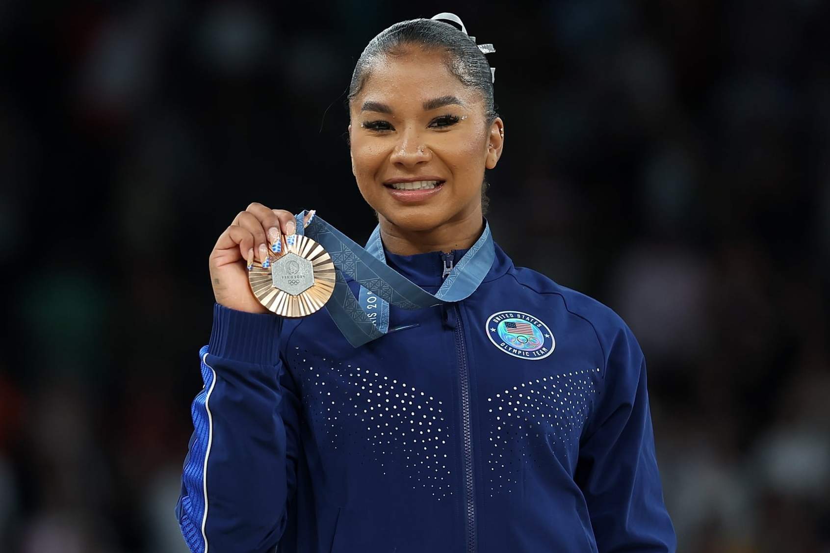 Bronze medalist Jordan Chiles of the United States poses for photos during the victory ceremony of women's floor exercise of artistic gymnastics at the Paris 2024 Olympic Games in Paris, France, Aug. 5, 2024. (Photo by Cao Can/Xinhua via Getty Images)