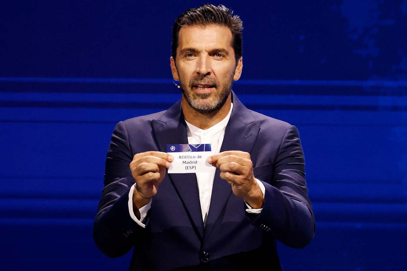MONACO, MONACO - AUGUST 29: Gianluigi Buffon, Winner of UEFA President's Award 2024 draws out the name of Atletico de Madrid during the UEFA Champions League 2024/25 Group Stage Draw at Grimaldi Forum on August 29, 2024 in Monaco, Monaco. (Photo by Claudio Lavenia - UEFA/UEFA via Getty Images)