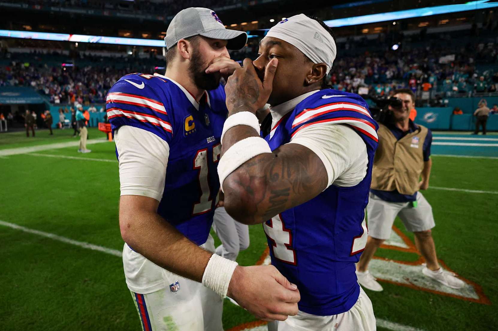 MIAMI GARDENS, FL - JANUARY 07: Josh Allen #17 of the Buffalo Bills talks with Stefon Diggs #14 after an NFL football game against the Miami Dolphins at Hard Rock Stadium on January 7, 2024 in Miami Gardens, Florida. (Photo by Perry Knotts/Getty Images)