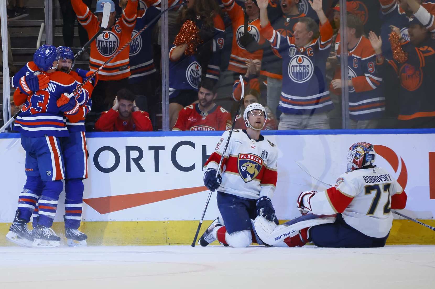 EDMONTON, ALBERTA - JUNE 21: Zach Hyman #18 and Ryan Nugent-Hopkins #93 of the Edmonton Oilers celebrate while Gustav Forsling #42 and Sergei Bobrovsky #72 of the Florida Panthers react after Hyman's goal during the second period of Game Six of the 2024 Stanley Cup Final at Rogers Place on June 21, 2024 in Edmonton, Alberta. (Photo by Bruce Bennett/Getty Images)