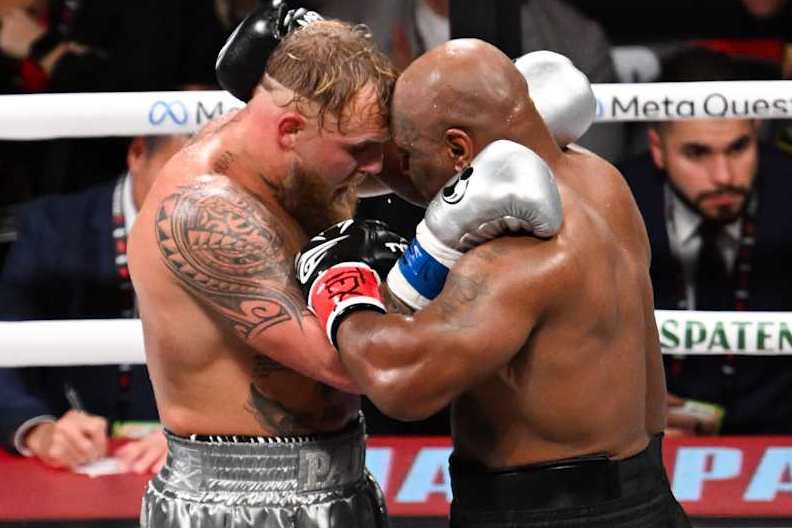 ARLINGTON, TEXAS - NOVEMBER 15: Mike Tyson (in black short) and Jake Paul (in silver short) hugs after 8th round of fight for their heavyweight world titles of the Premiere Boxing Championship on Friday night at AT&T Stadium in Arlington, Texas, United States on November 15, 2024. (Photo by Tayfun Coskun/Anadolu via Getty Images)
