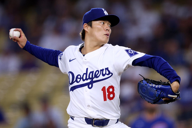 LOS ANGELES, CALIFORNIA - SEPTEMBER 10: Yoshinobu Yamamoto #18 of the Los Angeles Dodgers pitches against the Chicago Cubs during the first inning at Dodger Stadium on September 10, 2024 in Los Angeles, California. (Photo by Harry How/Getty Images)