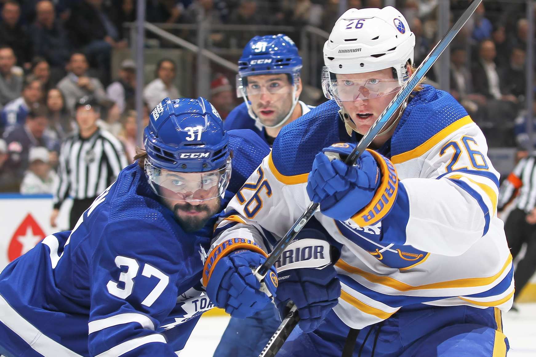 TORONTO, CANADA - MARCH 6: Rasmus Dahlin #26 of the Buffalo Sabres battles against Timothy Liljegren #37 of the Toronto Maple Leafs during the first period in an NHL game at Scotiabank Arena on March 6, 2024 in Toronto, Ontario, Canada. The Maple Leafs defeated the Sabres 2-1 in overtime. (Photo by Claus Andersen/Getty Images)