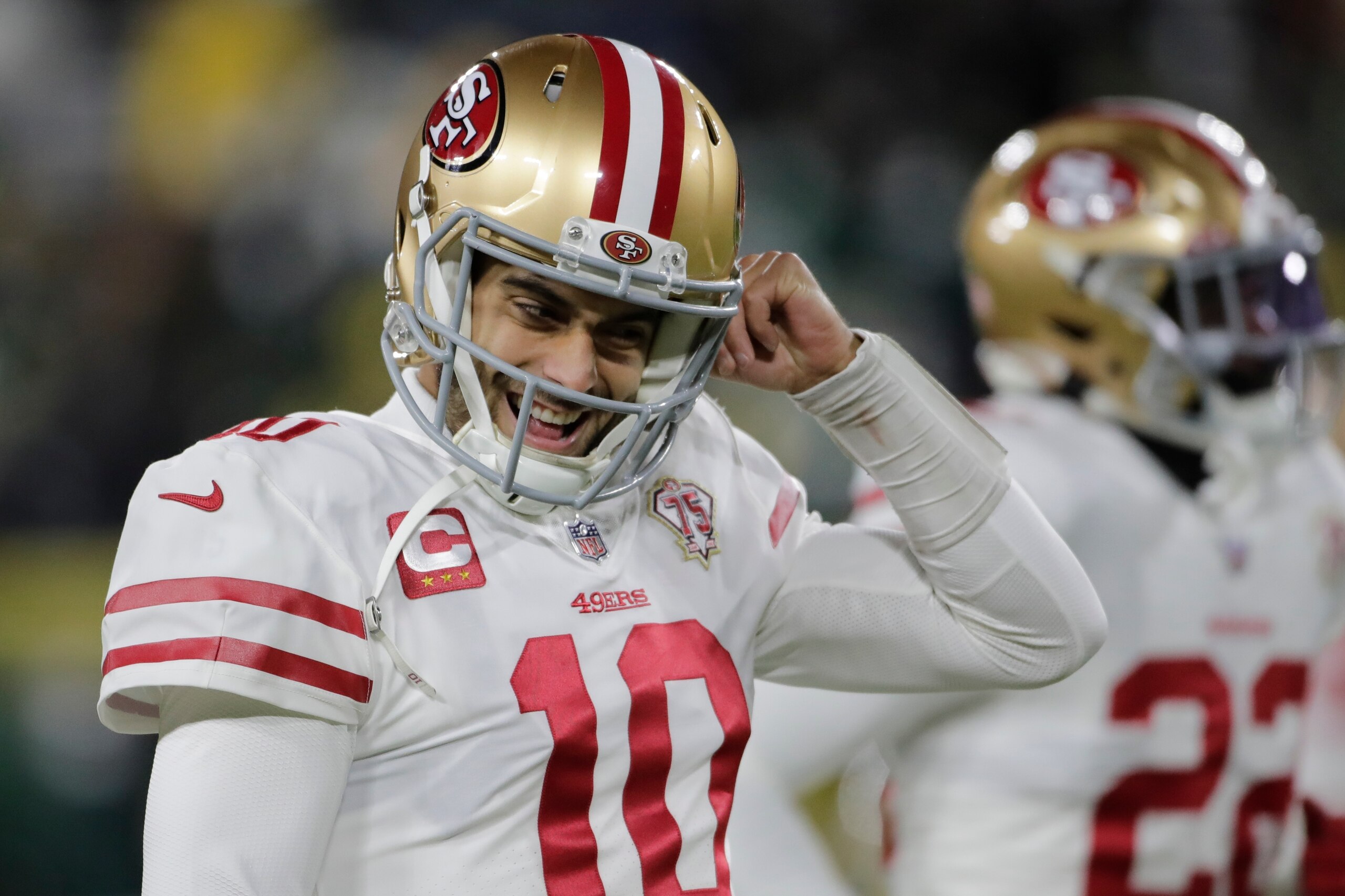 San Francisco 49ers' Jimmy Garoppolo warms up before an NFC divisional playoff NFL football game against the Green Bay Packers Saturday, Jan. 22, 2022, in Green Bay, Wis. (AP Photo/Aaron Gash)