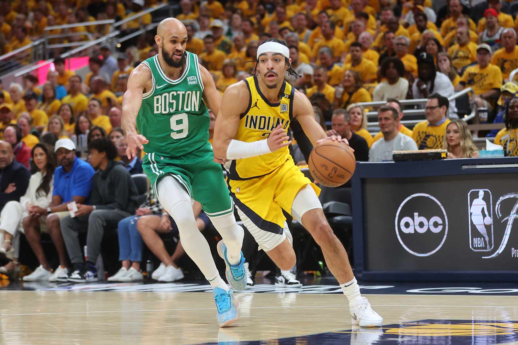 INDIANAPOLIS, INDIANA - MAY 25: Andrew Nembhard #2 of the Indiana Pacers is defended by Derrick White #9 of the Boston Celtics during Game Three of the Eastern Conference Finals at Gainbridge Fieldhouse on May 25, 2024 in Indianapolis, Indiana. NOTE TO USER: User expressly acknowledges and agrees that, by downloading and or using this photograph, User is consenting to the terms and conditions of the Getty Images License Agreement. (Photo by Stacy Revere/Getty Images)