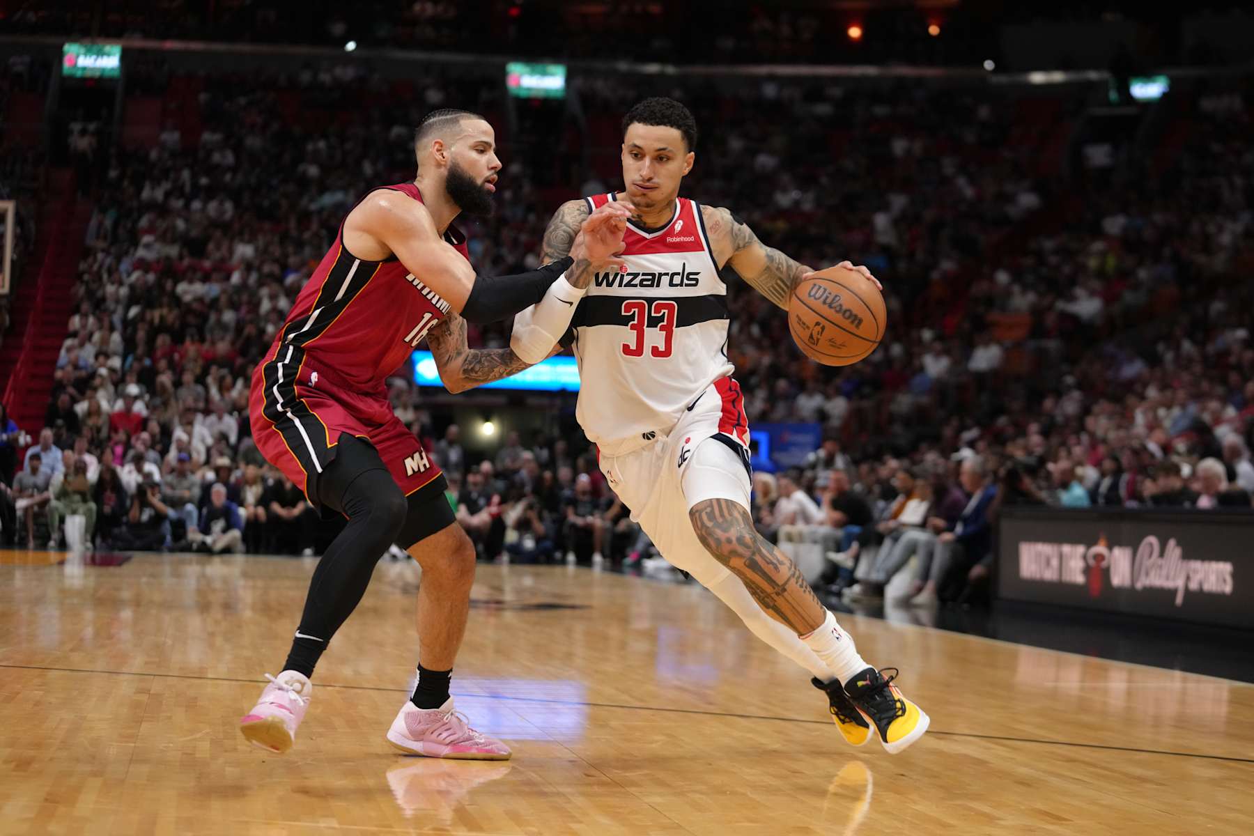 MIAMI, FL - MARCH 10: Kyle Kuzma #33 of the Washington Wizards handles the ball during the game against the Miami Heat on March 10, 2024 at Kaseya Center in Miami, Florida. NOTE TO USER: User expressly acknowledges and agrees that, by downloading and or using this Photograph, user is consenting to the terms and conditions of the Getty Images License Agreement. Mandatory Copyright Notice: Copyright 2024 NBAE (Photo by Eric Espada/NBAE via Getty Images)