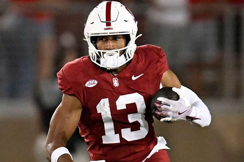 STANFORD, CALIFORNIA - AUGUST 30: Elic Ayomanor #13 of the Stanford Cardinal runs the ball against the TCU Horned Frogs in the fourth quarter at Stanford Stadium on August 30, 2024 in Stanford, California. (Photo by Eakin Howard/Getty Images)