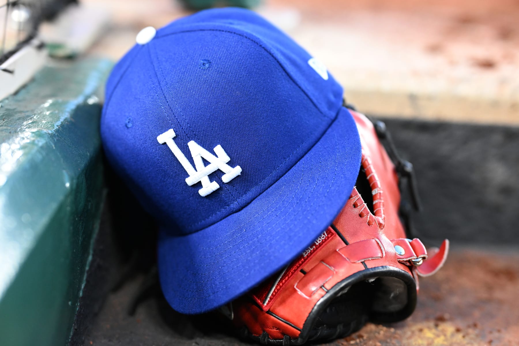 WASHINGTON, DC - APRIL 24: A view of a Los Angeles Dodgers baseball cap in the dugout during the game against the Washington Nationals at Nationals Park on April 24, 2024 in Washington, DC. (Photo by G Fiume/Getty Images)