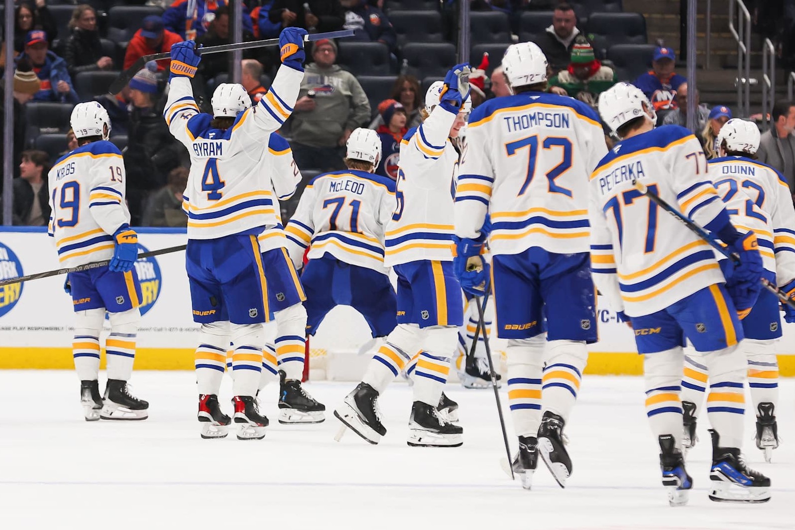 ELMONT, NEW YORK - DECEMBER 23: The Buffalo Sabres celebrate after defeating the New York Islanders at UBS Arena on December 23, 2024 in Elmont, New York. (Photo by Andrew Mordzynski/Getty Images)