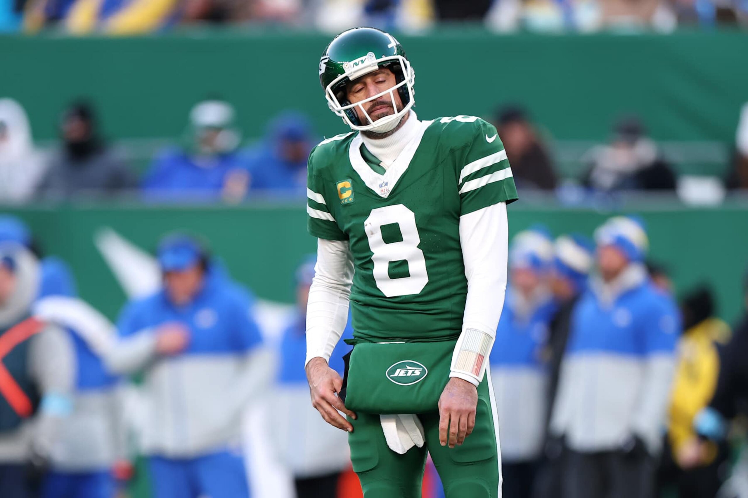 EAST RUTHERFORD, NEW JERSEY - DECEMBER 22: Aaron Rodgers #8 of the New York Jets reacts after being sacked and fumbling the ball during the fourth quarter against the Los Angeles Rams at MetLife Stadium on December 22, 2024 in East Rutherford, New Jersey. (Photo by Emilee Chinn/Getty Images)
