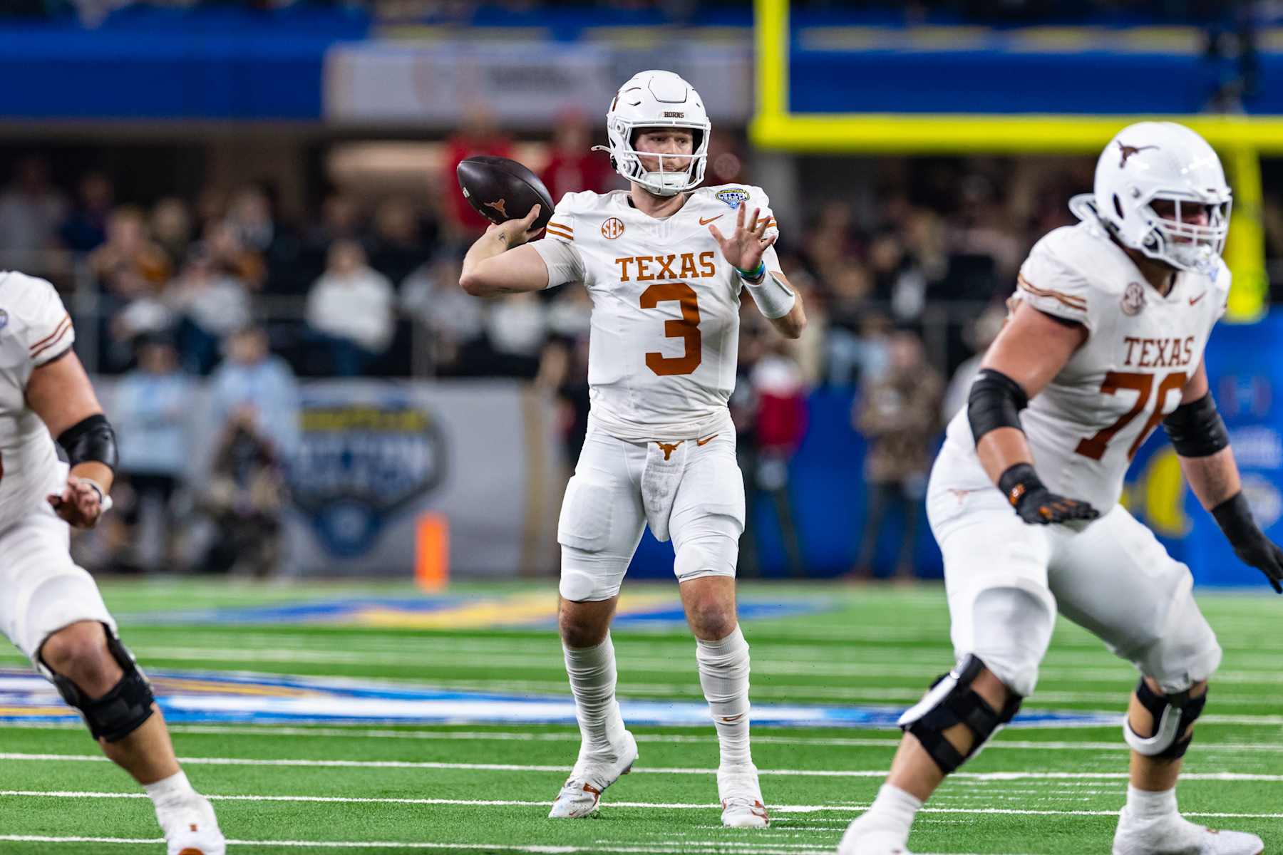ARLINGTON, TX - JANUARY 10: Texas Longhorns quarterback Quinn Ewers (#3) throws a pass during the CFP Semifinal Cotton Bowl Classic football game between the Ohio State Buckeyes and Texas Longhorns on January 10, 2025 at AT&T Stadium in Arlington, TX.  (Photo by Matthew Visinsky/Icon Sportswire via Getty Images)