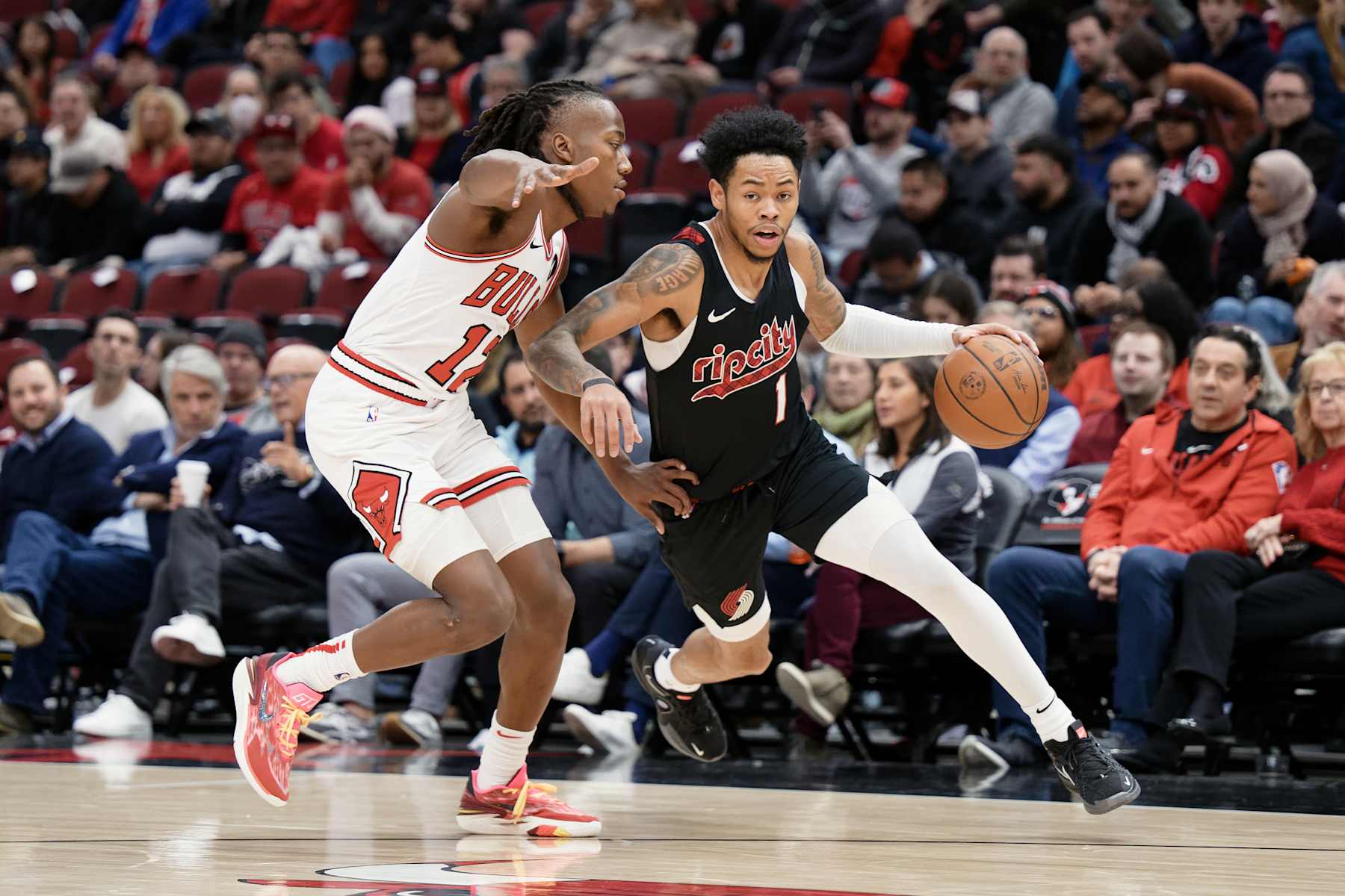 CHICAGO, ILLINOIS - MARCH 18:  Anfernee Simons #1 of the Portland Trail Blazers controls the ball against the Chicago Bulls on March 18, 2024 at United Center in Chicago, Illinois. Chicago defeated Portland 110-107.   NOTE TO USER: User expressly acknowledges and agrees that, by downloading and or using this photograph, User is consenting to the terms and conditions of the Getty Images License Agreement.  (Photo by Jamie Sabau/Getty Images)