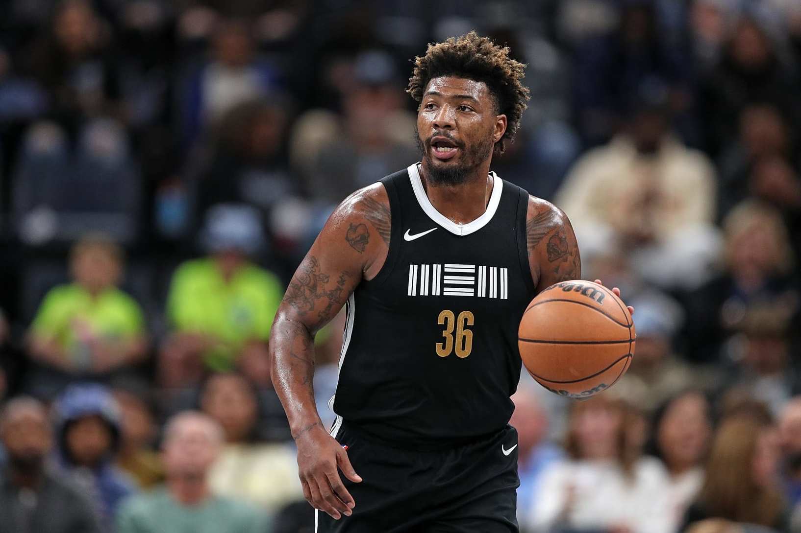 MEMPHIS, TENNESSEE - NOVEMBER 10: Marcus Smart #36 of the Memphis Grizzlies brings the ball up court during the game against the Utah Jazz at FedExForum on November 10, 2023 in Memphis, Tennessee. NOTE TO USER: User expressly acknowledges and agrees that, by downloading and or using this photograph, User is consenting to the terms and conditions of the Getty Images License Agreement. (Photo by Justin Ford/Getty Images)