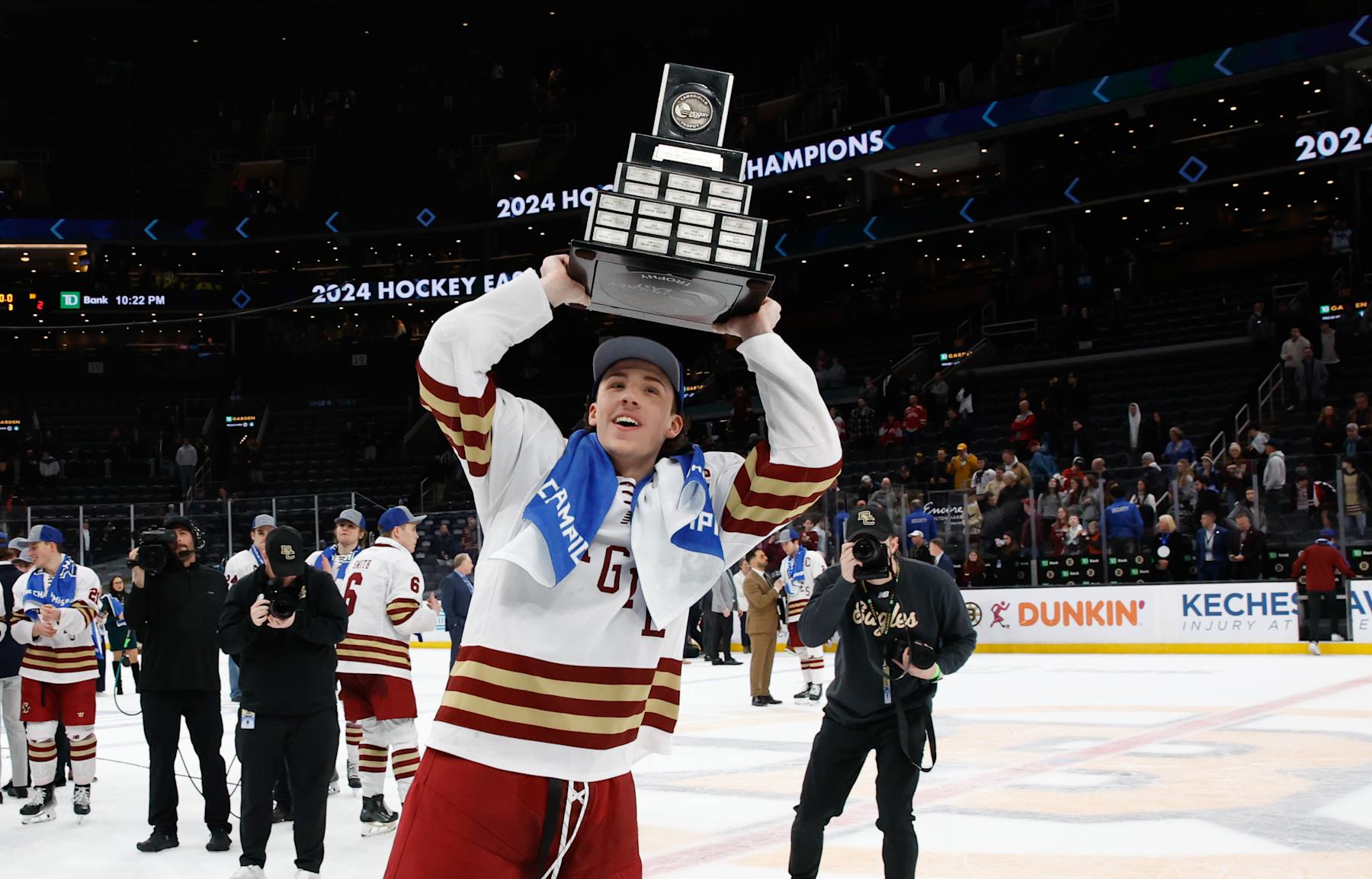 BOSTON, MASSACHUSETTS - MARCH 23: Gabe Perreault #34 of the Boston College Eagles celebrates with the Lamoriello Trophy after winning the Hockey East championship after a win against the Boston University Terriers during the Hockey East Championship final at TD Garden on March 23, 2024 in Boston, Massachusetts. The Eagles won 6-2 and captured their first Hockey East title in twelve years. (Photo by Richard T Gagnon/Getty Images)