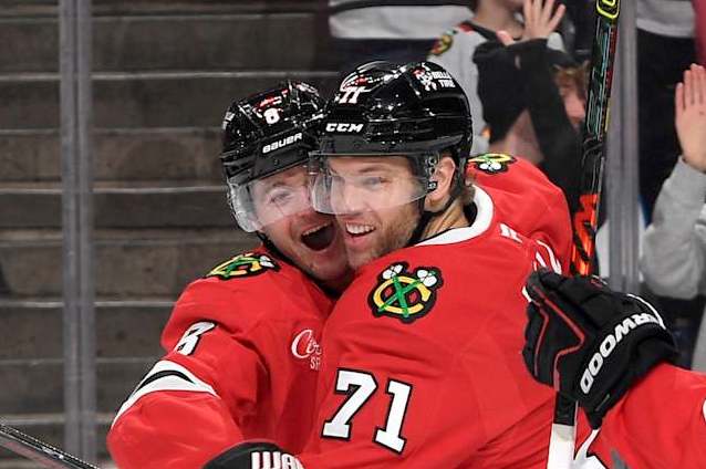 Chicago Blackhawks forward Ryan Donato (left) and Taylor Hall.