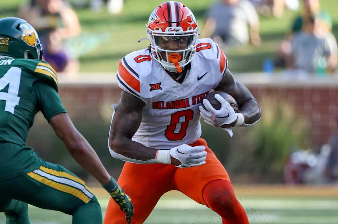 WACO, TX - OCTOBER 26: Oklahoma State Cowboys running back Ollie Gordon II (0) cuts back trying to avoid Baylor Bears safety Corey Gordon Jr. (24) during the Big 12 college football game between Baylor Bears and Oklahoma State Cowboys on October 26, 2024, at McLane Stadium in Waco, TX.  (Photo by David Buono/Icon Sportswire via Getty Images)