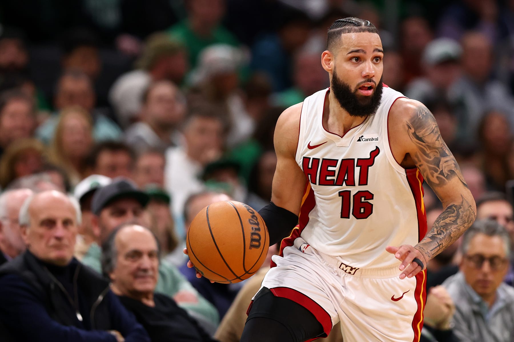 BOSTON, MASSACHUSETTS - MAY 01: Caleb Martin #16 of the Miami Heat dribbles against the Boston Celtics during the second quarter of game five of the Eastern Conference First Round Playoffs at TD Garden on May 01, 2024 in Boston, Massachusetts. NOTE TO USER: User expressly acknowledges and agrees that, by downloading and/or using this Photograph, user is consenting to the terms and conditions of the Getty Images License Agreement.  (Photo by Maddie Meyer/Getty Images)