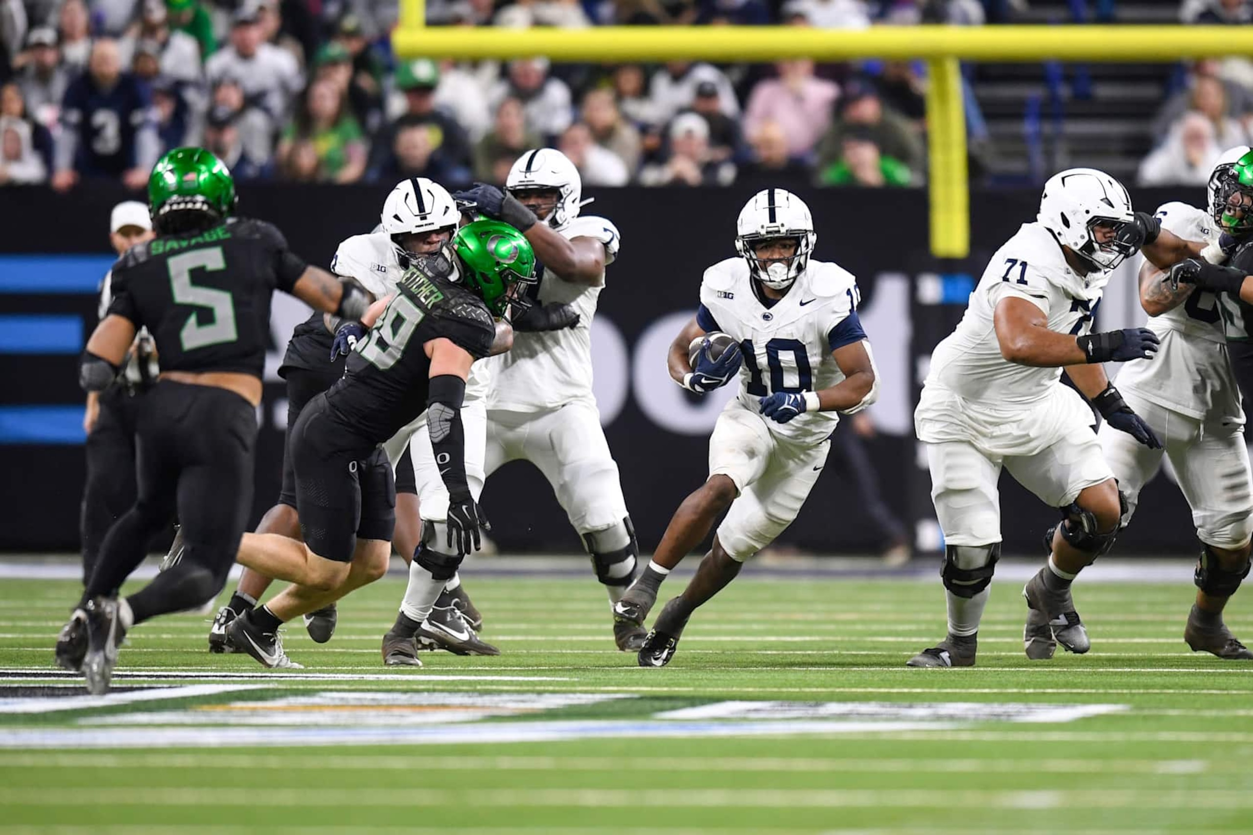 INDIANAPOLIS, IN - DECEMBER 07: Penn State Nittany Lions Running Back Nicholas Singleton (10) carries the ball during the Big Ten Championship football game between the Penn State Nittany Lions and the Oregon Ducks on December 7, 2024, at Lucas Oil Stadium in Indianapolis, Indiana. (Photo by Michael Allio/Icon Sportswire via Getty Images)