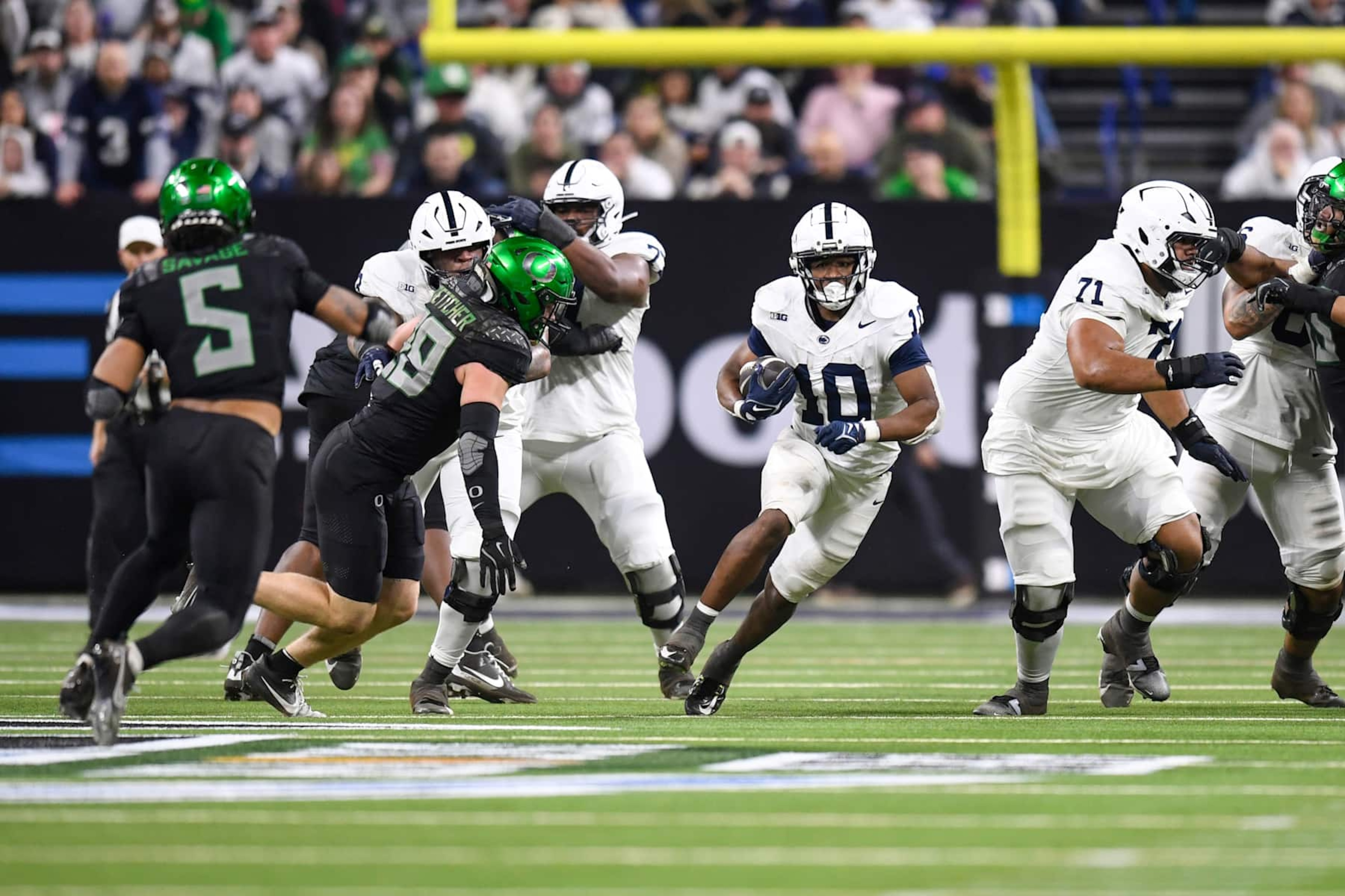 INDIANAPOLIS, IN - DECEMBER 07: Penn State Nittany Lions Running Back Nicholas Singleton (10) carries the ball during the Big Ten Championship football game between the Penn State Nittany Lions and the Oregon Ducks on December 7, 2024, at Lucas Oil Stadium in Indianapolis, Indiana. (Photo by Michael Allio/Icon Sportswire via Getty Images)
