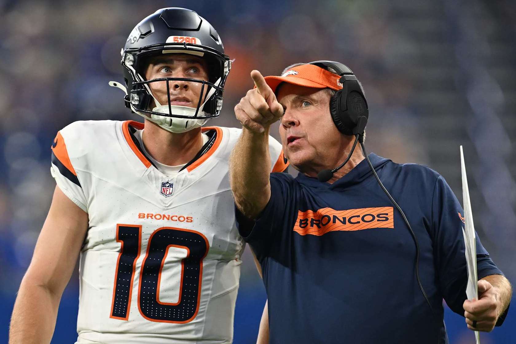 INDIANAPOLIS, INDIANA - AUGUST 11: Denver Broncos quarterback Bo Nix (10), left, talks with Denver Broncos head coach Sean Payton during a drive late in the 2nd quarter at Lucas Oil Stadium in Indianapolis, Indiana on August 11, 2024. The Indianapolis Colts hosted the Denver Broncos for their first NFL Preseason game of the 2024 summer. (Photo by RJ Sangosti/The Denver Post)