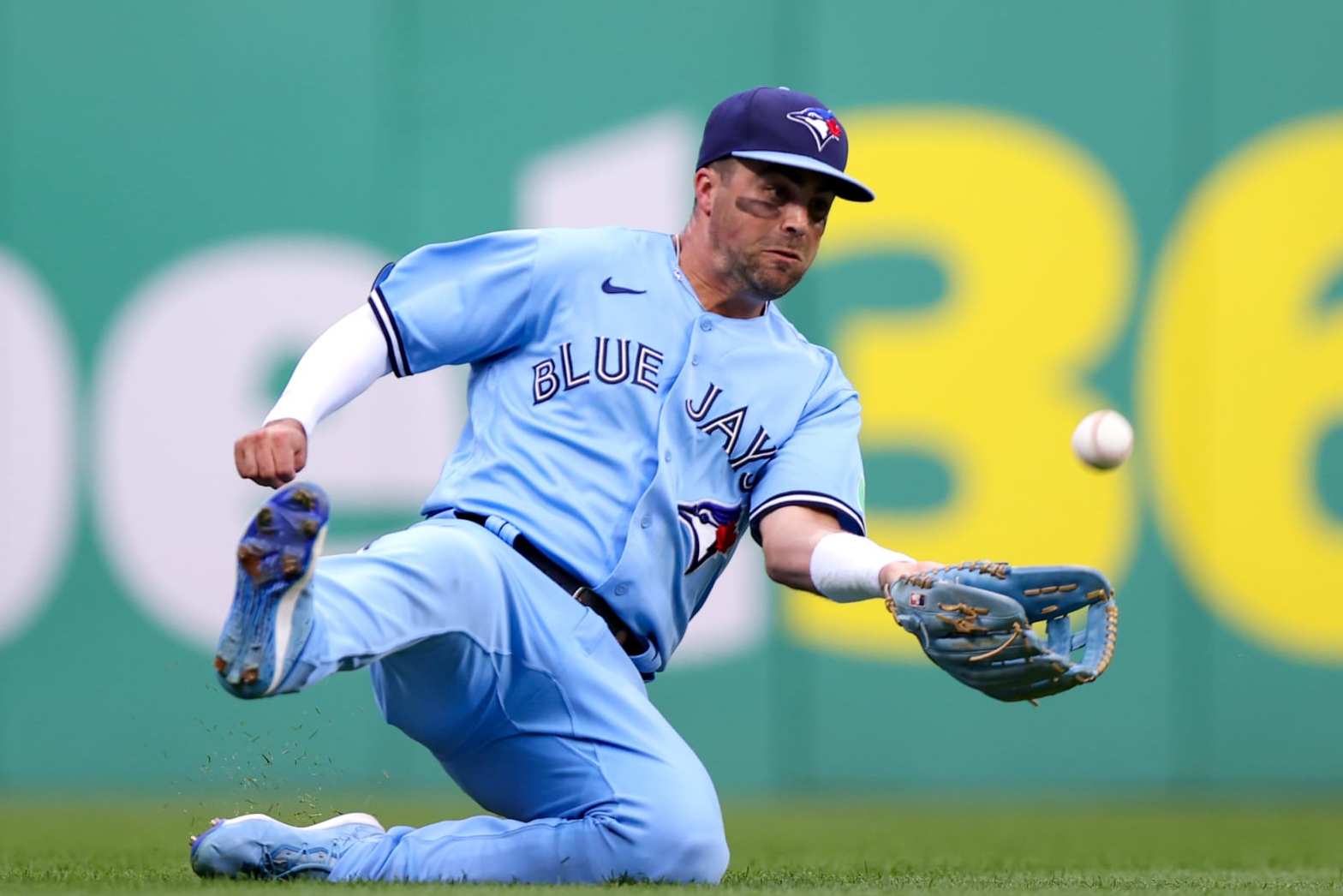 CLEVELAND, OH - AUGUST 09: Toronto Blue Jays left fielder Whit Merrifield (15) makes a sliding catch during the third inning of the Major League Baseball game between the Toronto Blue Jays and Cleveland Guardians on August 9, 2023, at Progressive Field in Cleveland, OH. (Photo by Frank Jansky/Icon Sportswire via Getty Images)