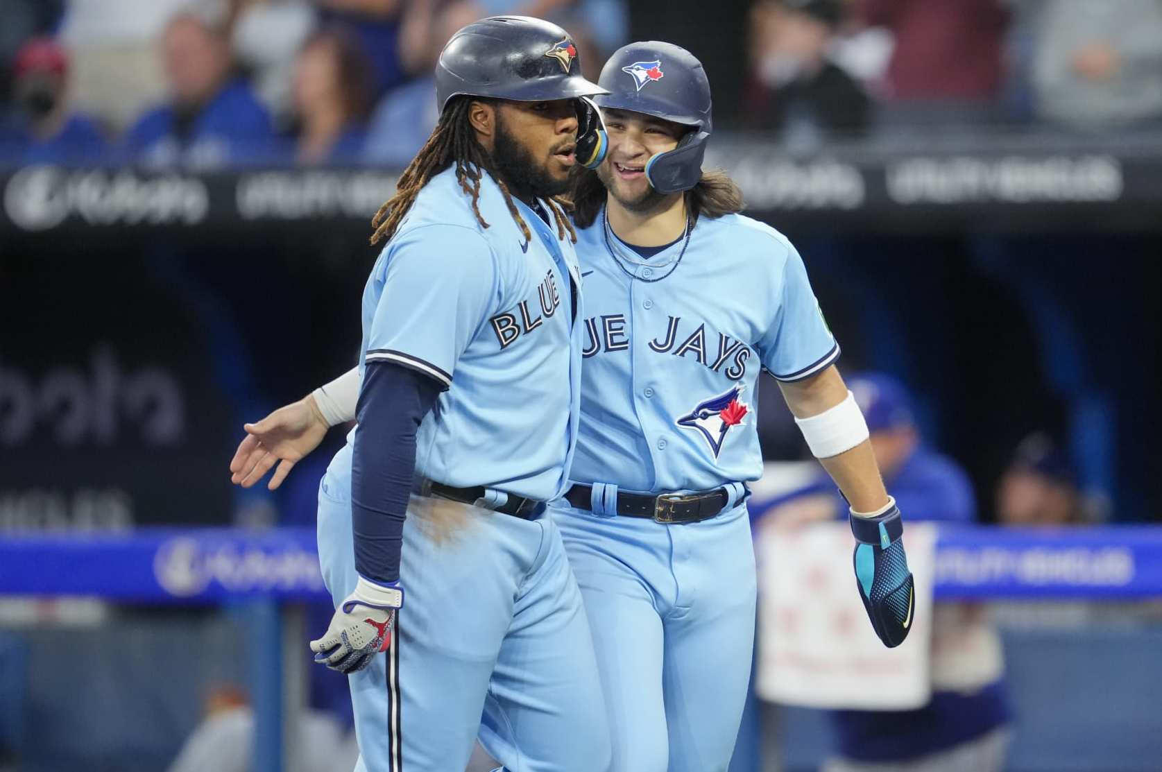 TORONTO, ON - SEPTEMBER 14: Vladimir Guerrero Jr. #27 of Toronto Blue Jays celebrates his home run with Bo Bichette #11 against the Texas Rangers during the first inning in their MLB game at the Rogers Centre on September 14, 2023 in Toronto, Ontario, Canada. (Photo by Mark Blinch/Getty Images)