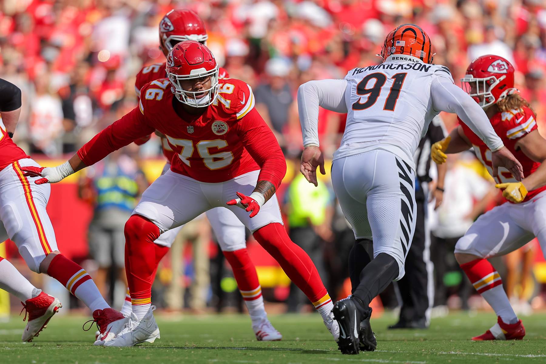 KANSAS CITY, MISSOURI - SEPTEMBER 15: Kingsley Suamataia #76 of the Kansas City Chiefs prepares to block Trey Hendrickson #91 of the Cincinnati Bengals during the first quarter at GEHA Field at Arrowhead Stadium on September 15, 2024 in Kansas City, Missouri. (Photo by David Eulitt/Getty Images)