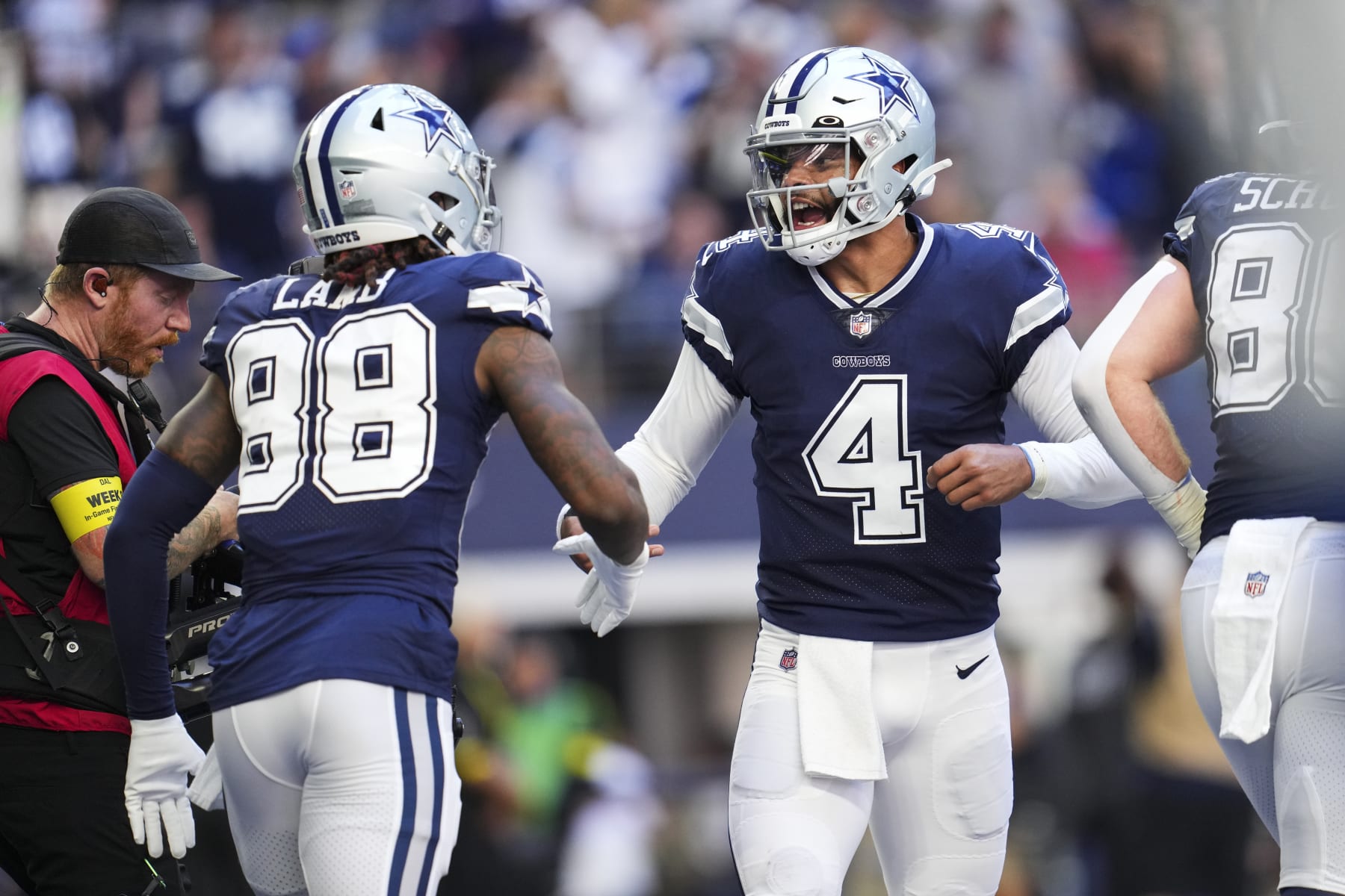 Dallas Cowboys wide receiver CeeDee Lamb (left) and quarterback Dak Prescott (right)