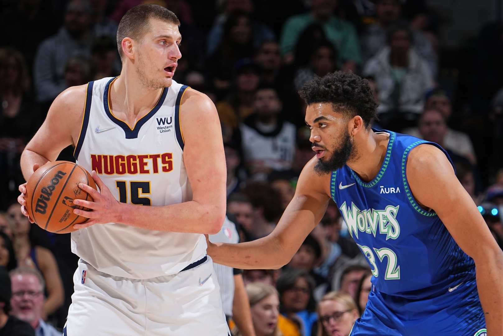DENVER, CO - APRIL 1: Karl-Anthony Towns #32 of the Minnesota Timberwolves plays defense on Nikola Jokic #15 of the Denver Nuggets on April 1, 2022 at the Ball Arena in Denver, Colorado. NOTE TO USER: User expressly acknowledges and agrees that, by downloading and/or using this Photograph, user is consenting to the terms and conditions of the Getty Images License Agreement. Mandatory Copyright Notice: Copyright 2022 NBAE (Photo by Bart Young/NBAE via Getty Images) DENVER, CO - APRIL 1: Karl-Anthony Towns #32 of the Minnesota Timberwolves plays defense on Nikola Jokic #15 of the Denver Nuggets on April 1, 2022 at the Ball Arena in Denver, Colorado. NOTE TO USER: User expressly acknowledges and agrees that, by downloading and/or using this Photograph, user is consenting to the terms and conditions of the Getty Images License Agreement. Mandatory Copyright Notice: Copyright 2022 NBAE (Photo by Bart Young/NBAE via Getty Images)