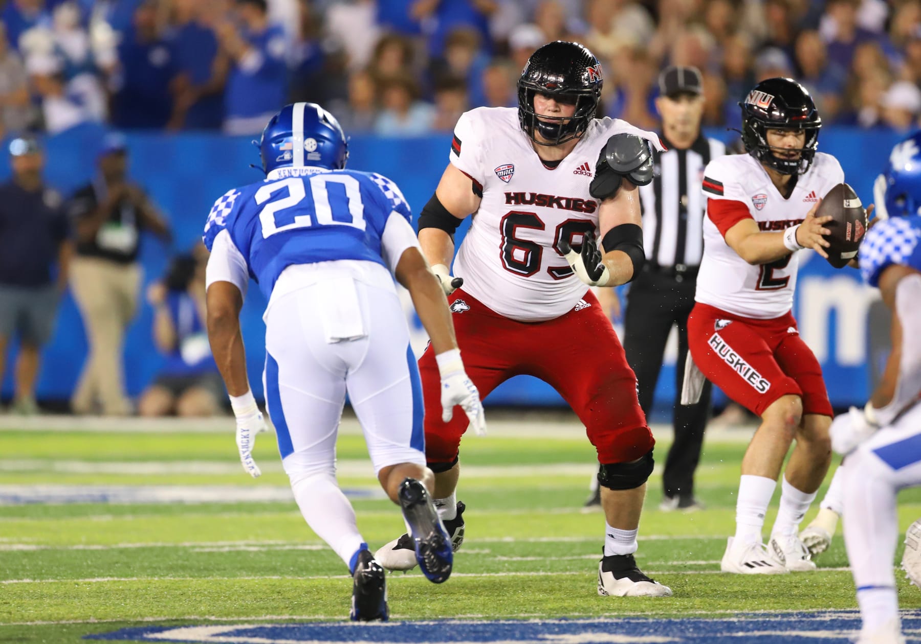 LEXINGTON, KY - SEPTEMBER 24: Northern Illinois Huskies offensive tackle Nolan Potter (69) protects quarterback Ethan Hampton (2) as Kentucky Wildcats linebacker Keaten Wade (20) approaches in a game between the Northern Illinois Huskies and Kentucky Wildcats on September 24, 2022, at Kroger Field in Lexington, KY. (Photo by Jeff Moreland/Icon Sportswire via Getty Images)