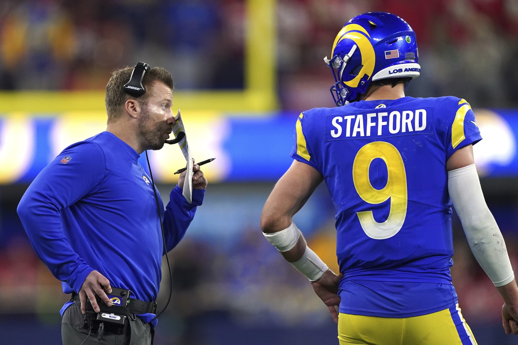 Los Angeles Rams head coach Sean McVay talks with quarterback Matthew Stafford (9) against the San Francisco 49ers during the NFL NFC Championship game, Sunday, Jan. 30, 2022 in Inglewood, Calif. The Rams defeated the 49ers 20-17. (AP Photo/Doug Benc)