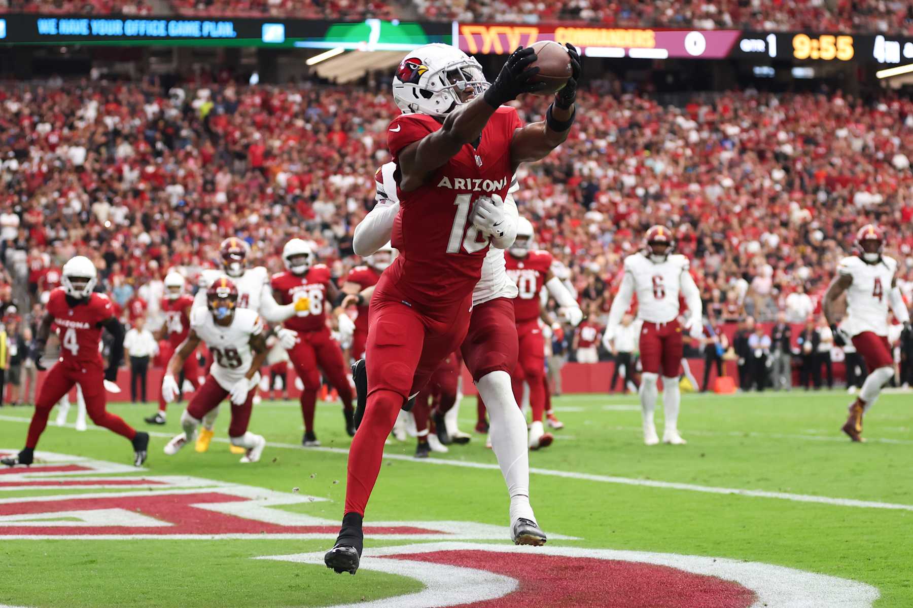 GLENDALE, ARIZONA - SEPTEMBER 29: Marvin Harrison Jr. #18 of the Arizona Cardinals catches a pass for a touchdown during the first quarter against the Washington Commanders at State Farm Stadium on September 29, 2024 in Glendale, Arizona. (Photo by Christian Petersen/Getty Images)