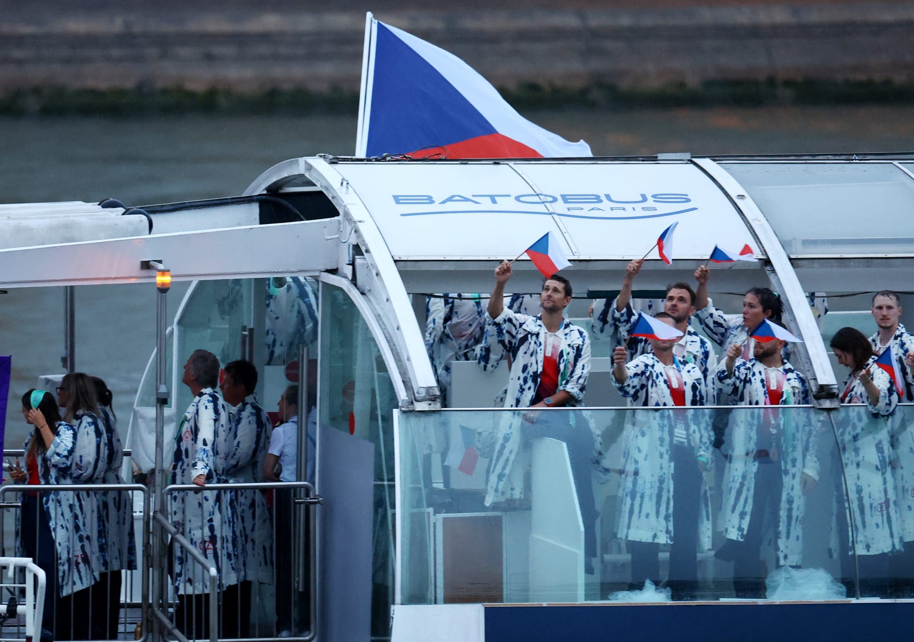PARIS, FRANCE - JULY 26: Athletes of Czech Republic aboard a boat in the floating parade on the river Seine during the Opening Ceremony of the Olympic Games Paris 2024 on July 26, 2024 in Paris, France. (Photo by Esa Alexander-Pool/Getty Images)
