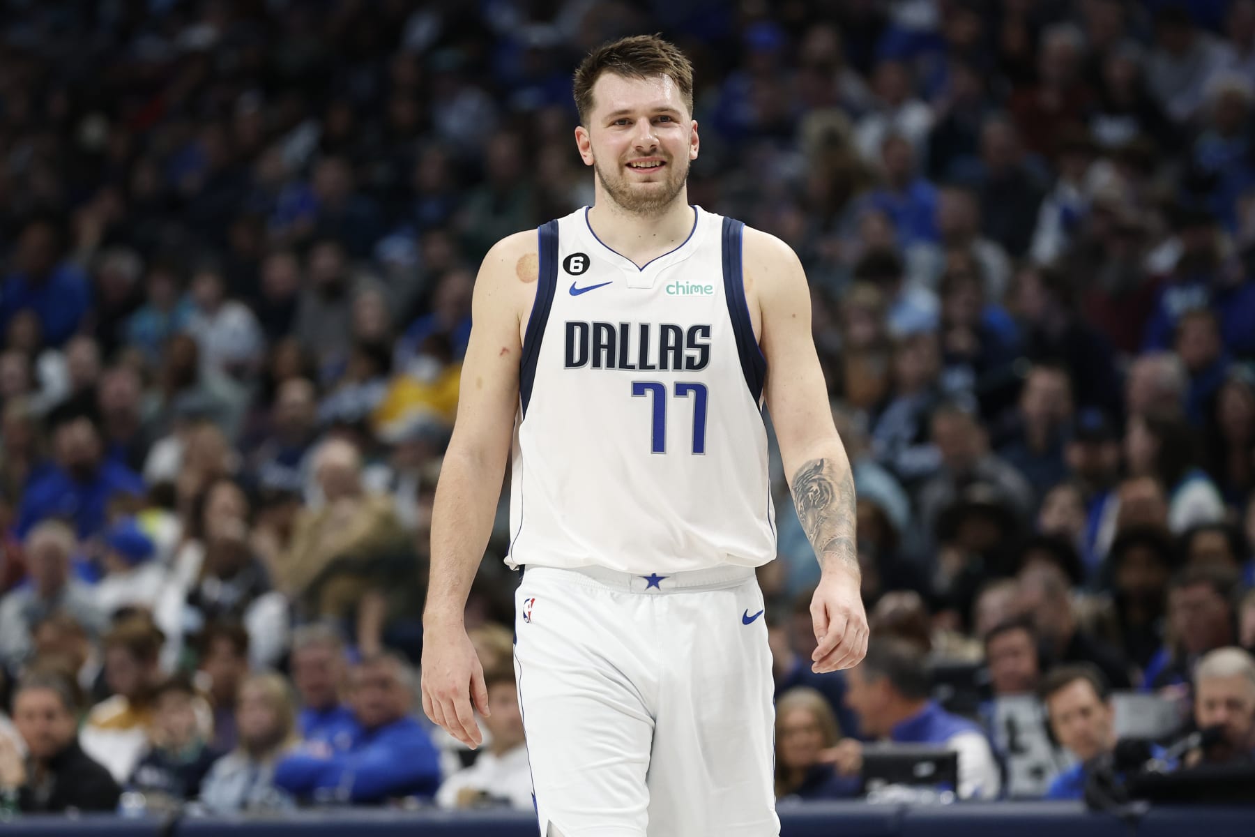 DALLAS, TEXAS - DECEMBER 29: Luka Doncic #77 of the Dallas Mavericks smiles while on the court in the game against the Houston Rockets at American Airlines Center on December 29, 2022 in Dallas, Texas. NOTE TO USER: User expressly acknowledges and agrees that, by downloading and or using this photograph, User is consenting to the terms and conditions of the Getty Images License Agreement. (Photo by Tim Heitman/Getty Images)