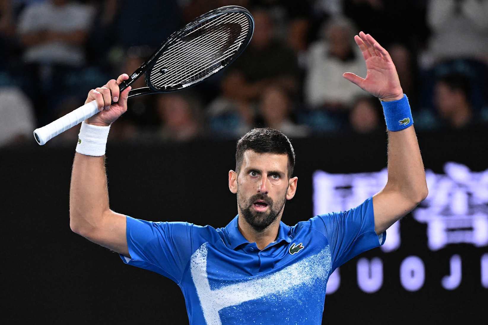 Serbia's Novak Djokovic reacts to a point against Spain's Carlos Alcaraz during their men's singles quarterfinal match on day ten of the Australian Open tennis tournament in Melbourne on January 22, 2025. (Photo by WILLIAM WEST / AFP) / -- IMAGE RESTRICTED TO EDITORIAL USE - STRICTLY NO COMMERCIAL USE -- (Photo by WILLIAM WEST/AFP via Getty Images)