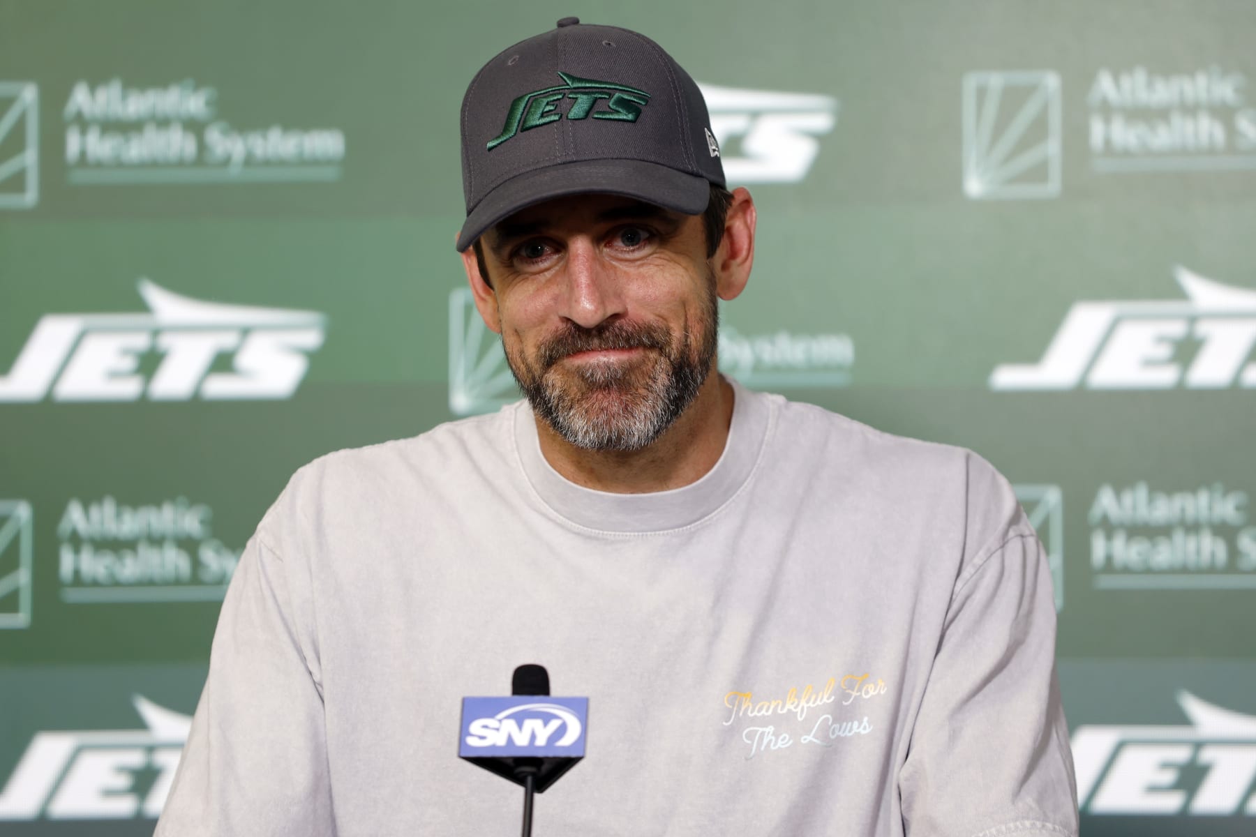 FLORHAM PARK, NEW JERSEY - MAY 21: Aaron Rodgers #8 of the New York Jets speaks to the media during the New York Jets OTA Offseason Workout at Atlantic Health Jets Training Center on May 21, 2024 in Florham Park, New Jersey. (Photo by Sarah Stier/Getty Images)