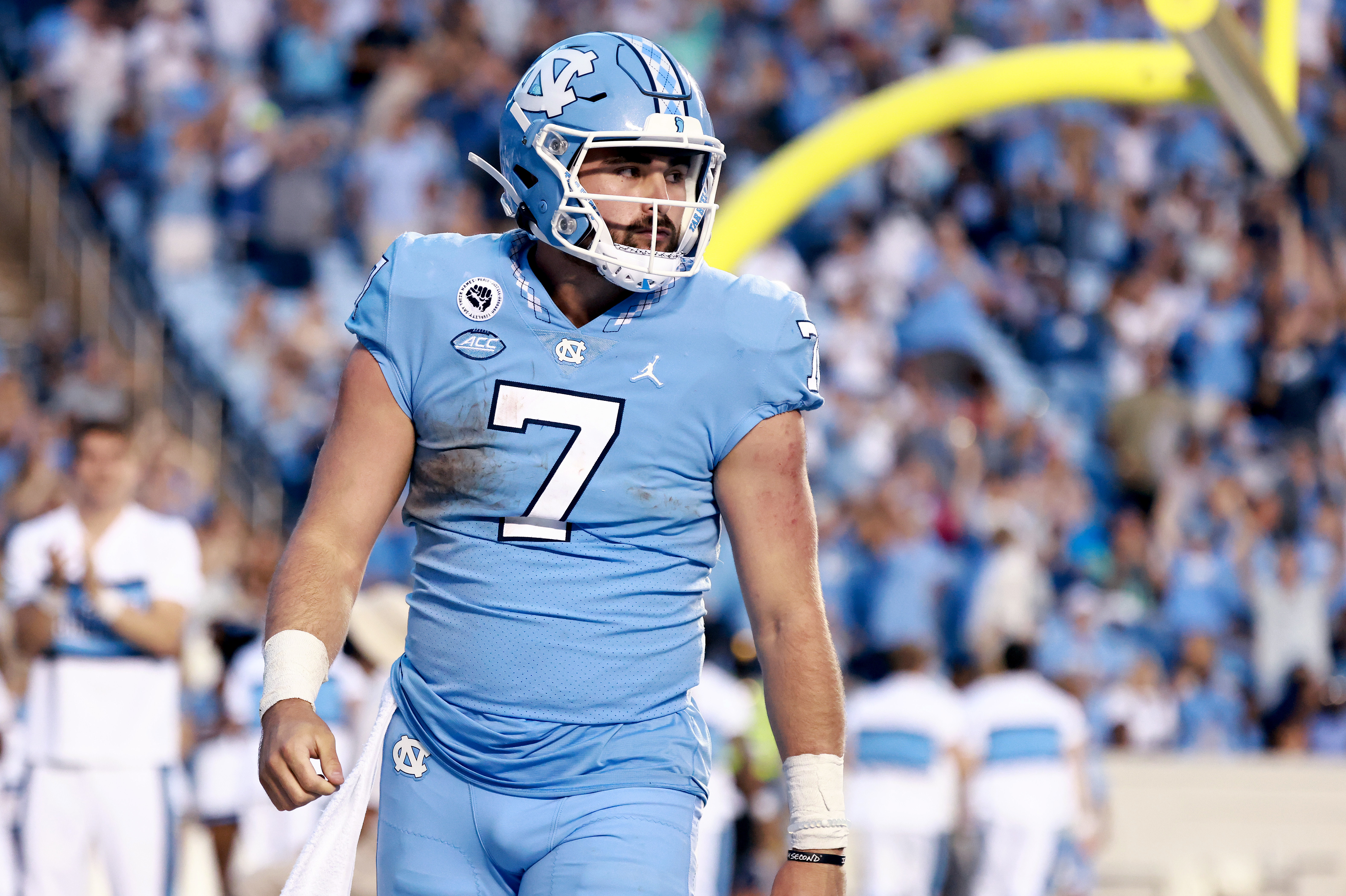 CHAPEL HILL, NORTH CAROLINA - OCTOBER 16: Sam Howell #7 of the North Carolina Tar Heels stares down the Miami Hurricanes defense after scoring a touchdown during their game at Kenan Memorial Stadium on October 16, 2021 in Chapel Hill, North Carolina. North Carolina won 45-42. (Photo by Grant Halverson/Getty Images)